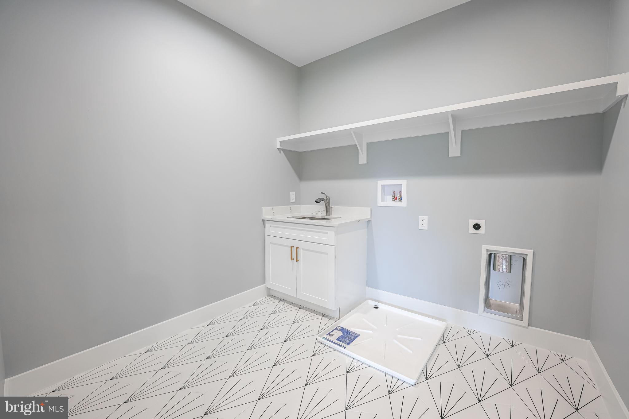 1422 Mayflower Drive McLean, VA 22101 - Photo 40 of 67 Laundry with sink, tile floor, and washer pan