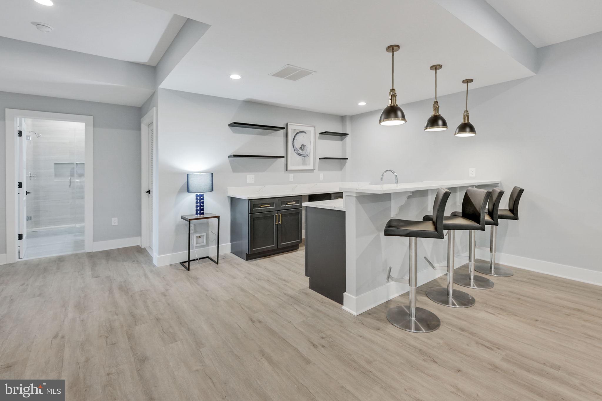 1422 Mayflower Drive McLean, VA 22101 - Photo 47 of 67 Wet bar has designer lighting and bar seating