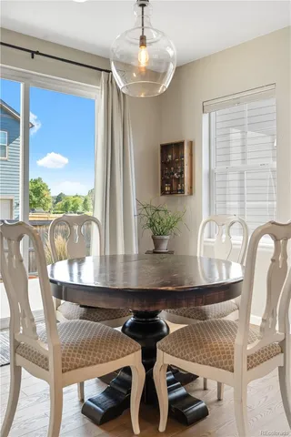 a view of a dining room with furniture window and outside view