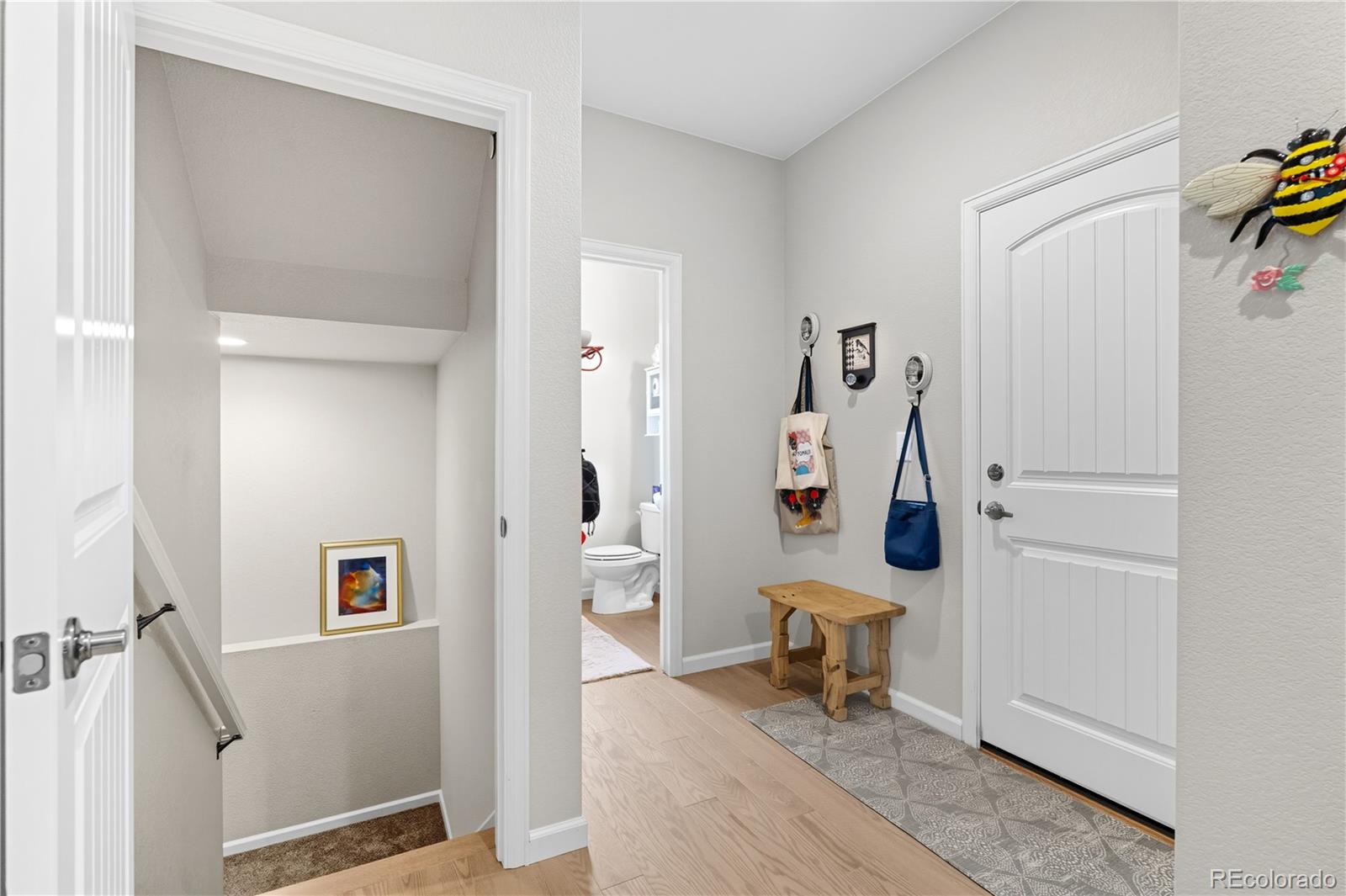 10074 Flower Street Broomfield, CO 80021 - Photo 19 of 47 a view of a hallway with front door and livingroom