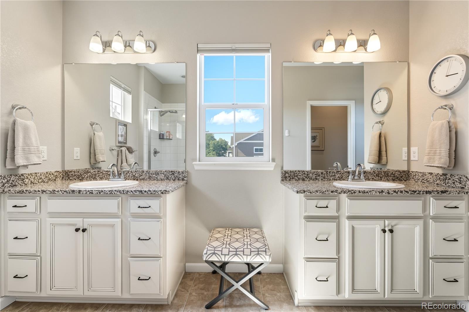 10074 Flower Street Broomfield, CO 80021 - Photo 23 of 47 a bathroom with a granite countertop sink and a mirror