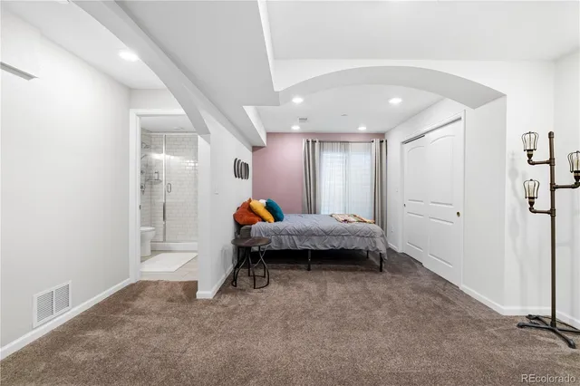 a bed room with a bed and a window