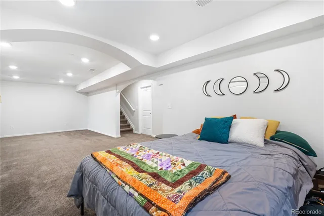 a bedroom with a bed and a table