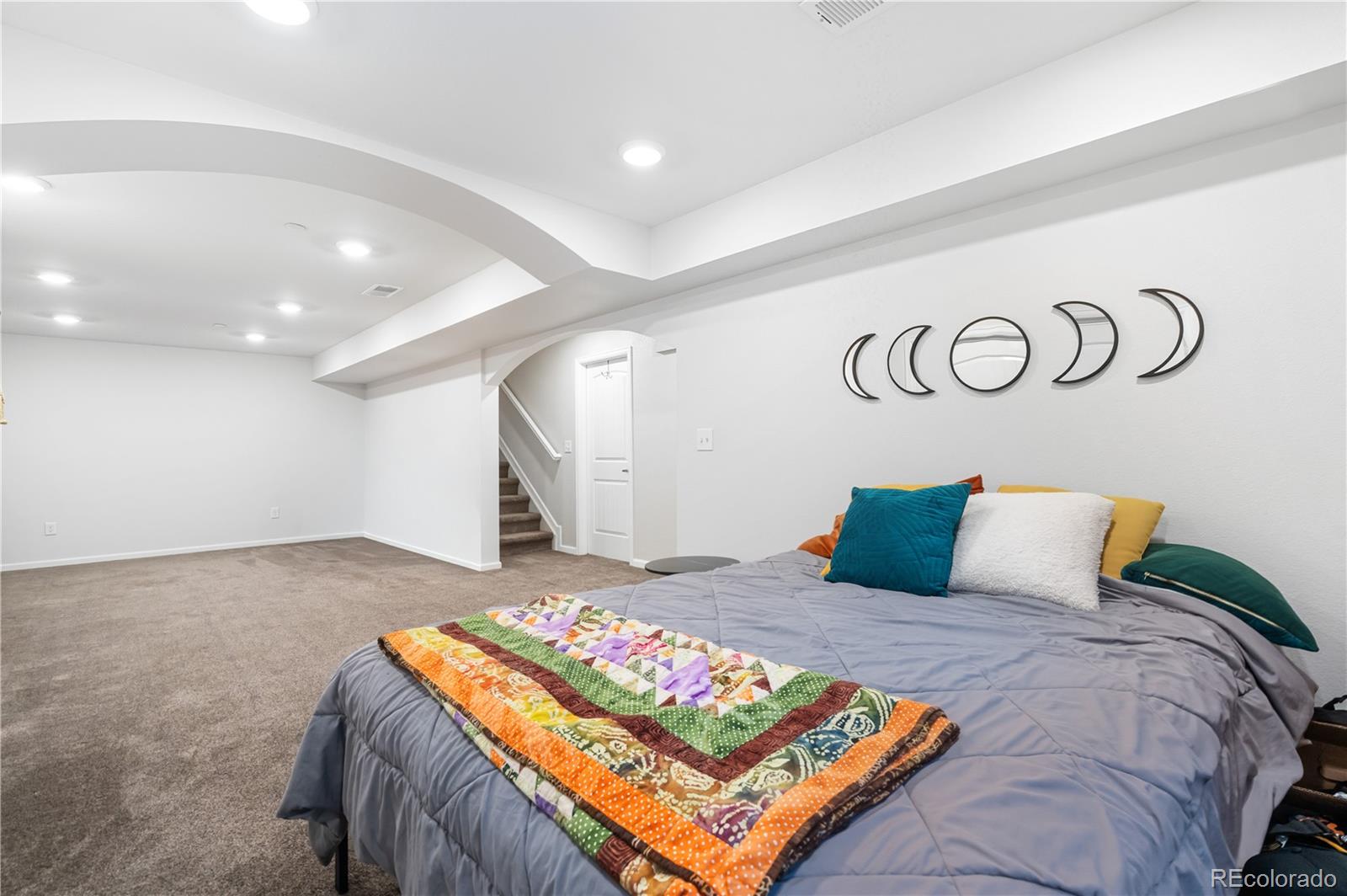 10074 Flower Street Broomfield, CO 80021 - Photo 36 of 47 a bedroom with a bed and a table