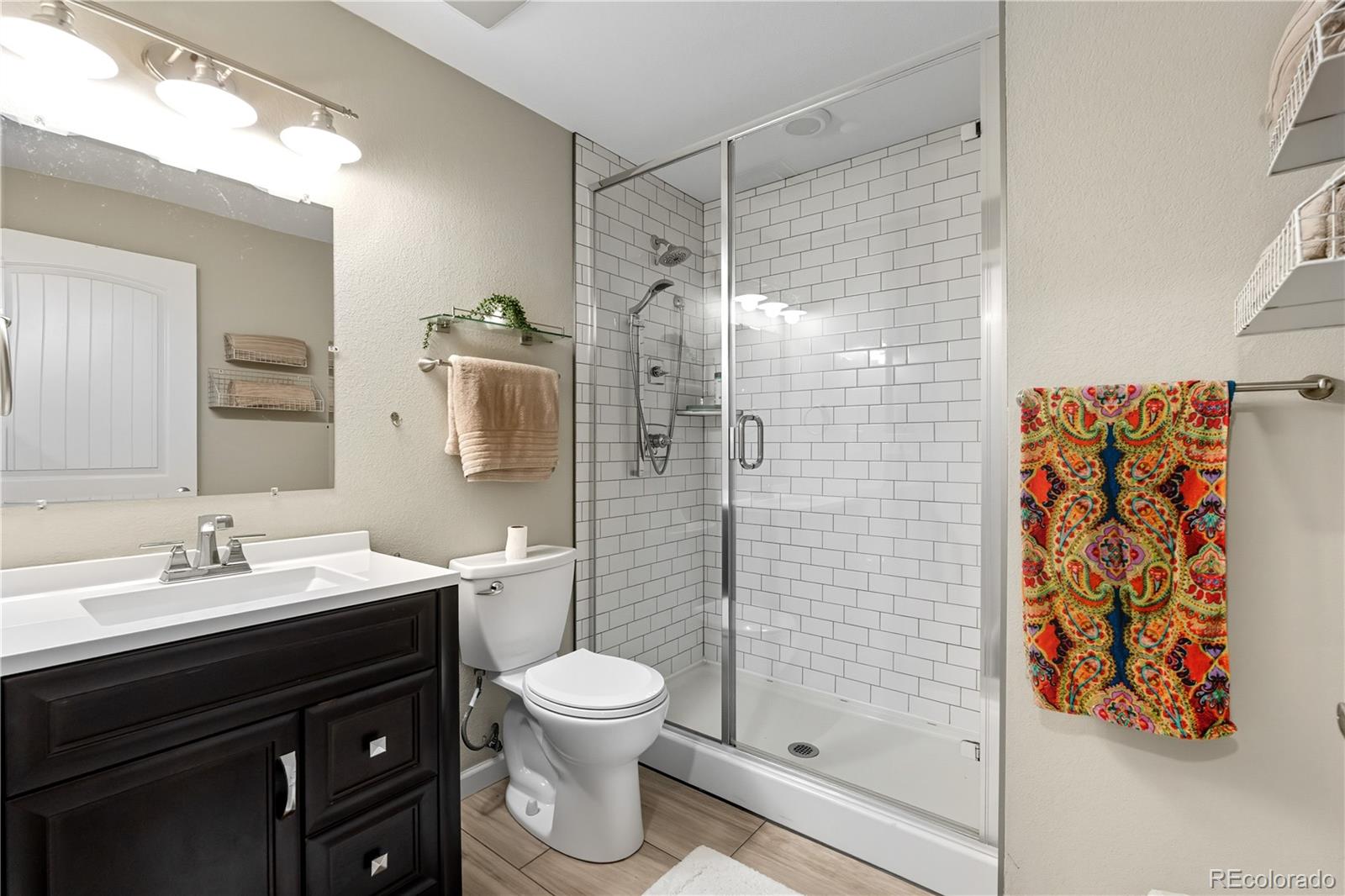 10074 Flower Street Broomfield, CO 80021 - Photo 38 of 47 a bathroom with a sink and a mirror