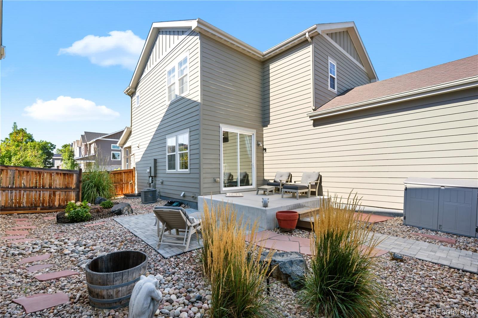 10074 Flower Street Broomfield, CO 80021 - Photo 39 of 47 a view of a patio with couches chairs and potted plants