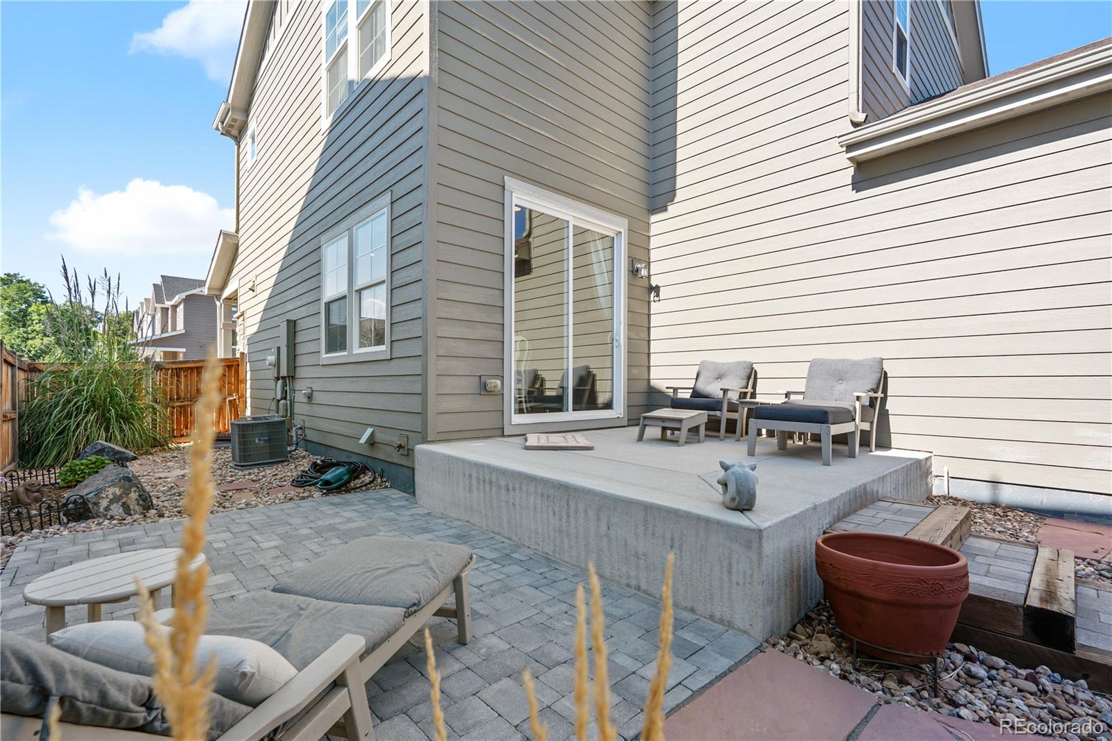 10074 Flower Street Broomfield, CO 80021 - Photo 40 of 47 a view of a dinning table and chairs in patio of the house