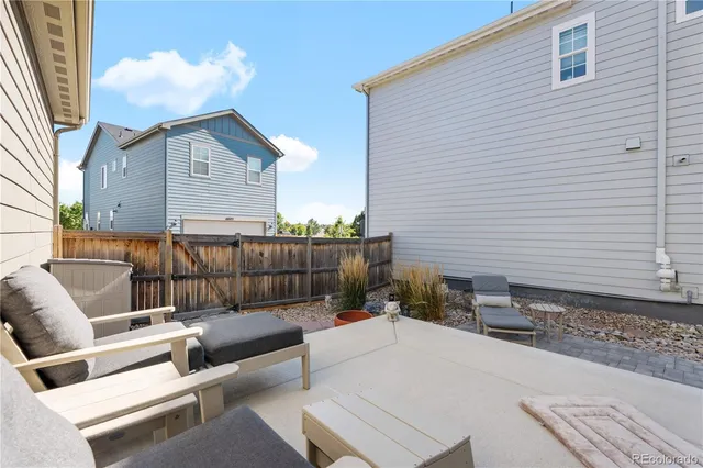 a view of a terrace with couches and a fire pit