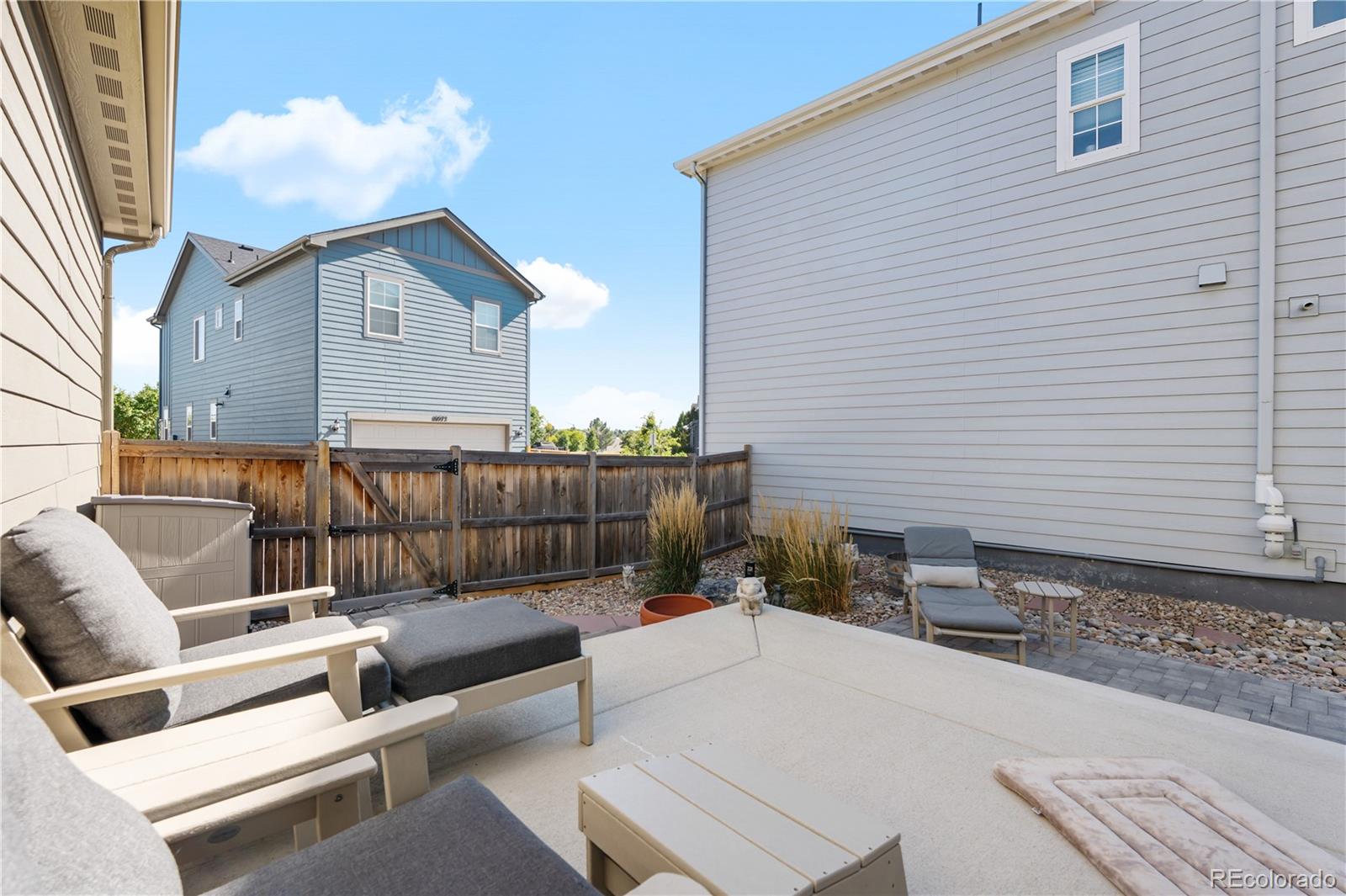 10074 Flower Street Broomfield, CO 80021 - Photo 41 of 47 a view of a terrace with couches and a fire pit