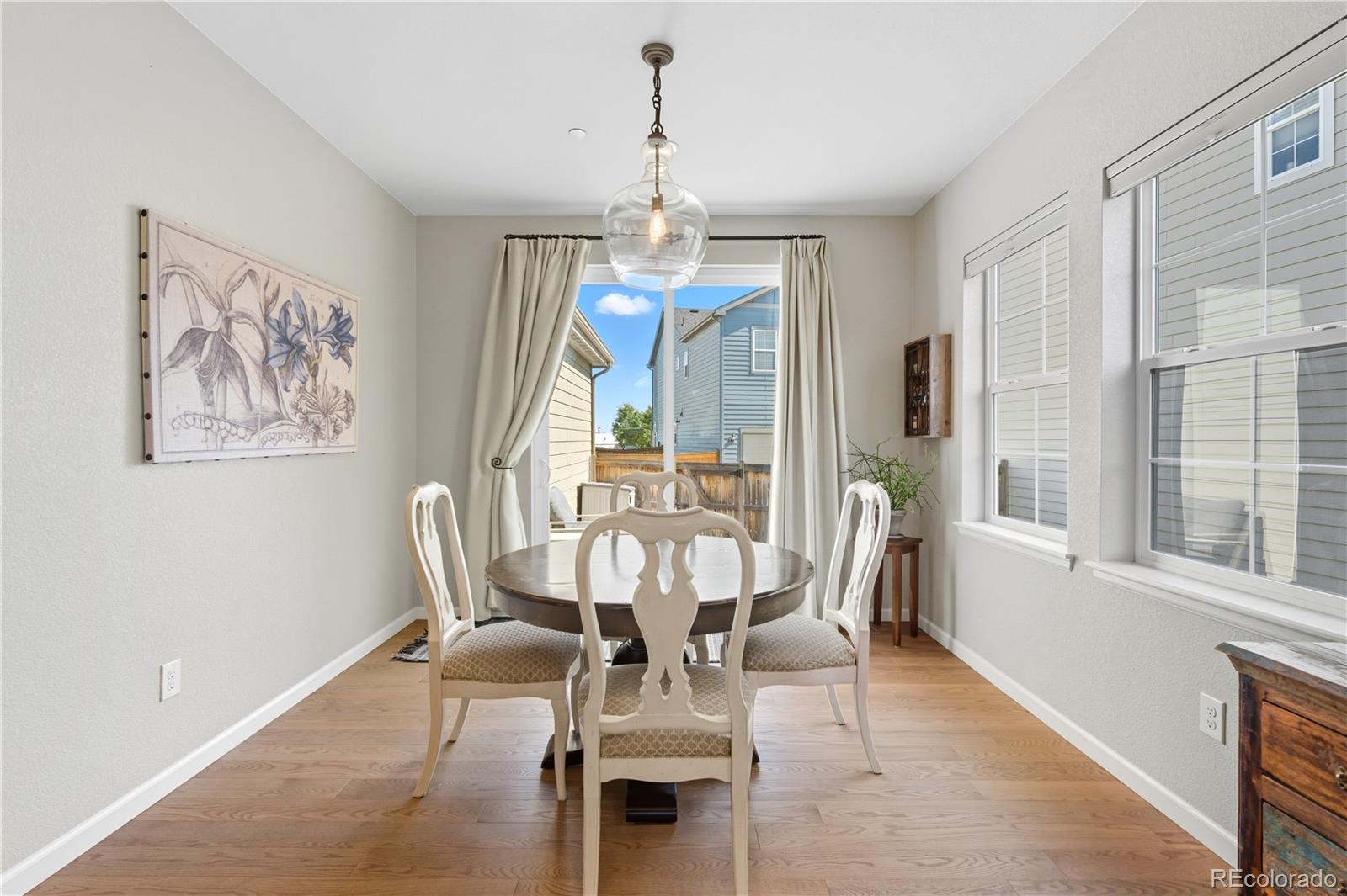 10074 Flower Street Broomfield, CO 80021 - Photo 9 of 47 a view of a dining room with furniture window and outside view
