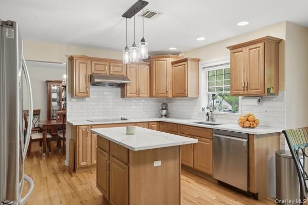 29 Hickory Hill Road Newburgh, NY 12550 - Photo 17 of 47 a kitchen that has a sink a microwave oven a stove and white cabinets with wooden floor