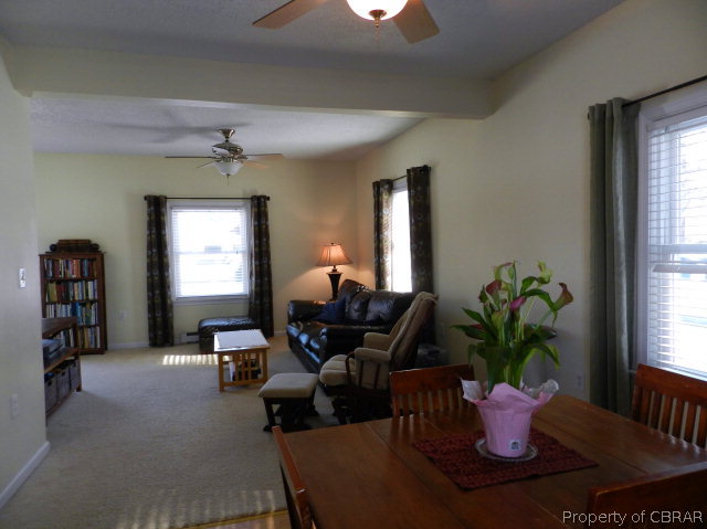 1611 Windsor Road Dutton, VA 23050 - Photo 8 of 30 a living room with furniture flowerpot and wooden floor