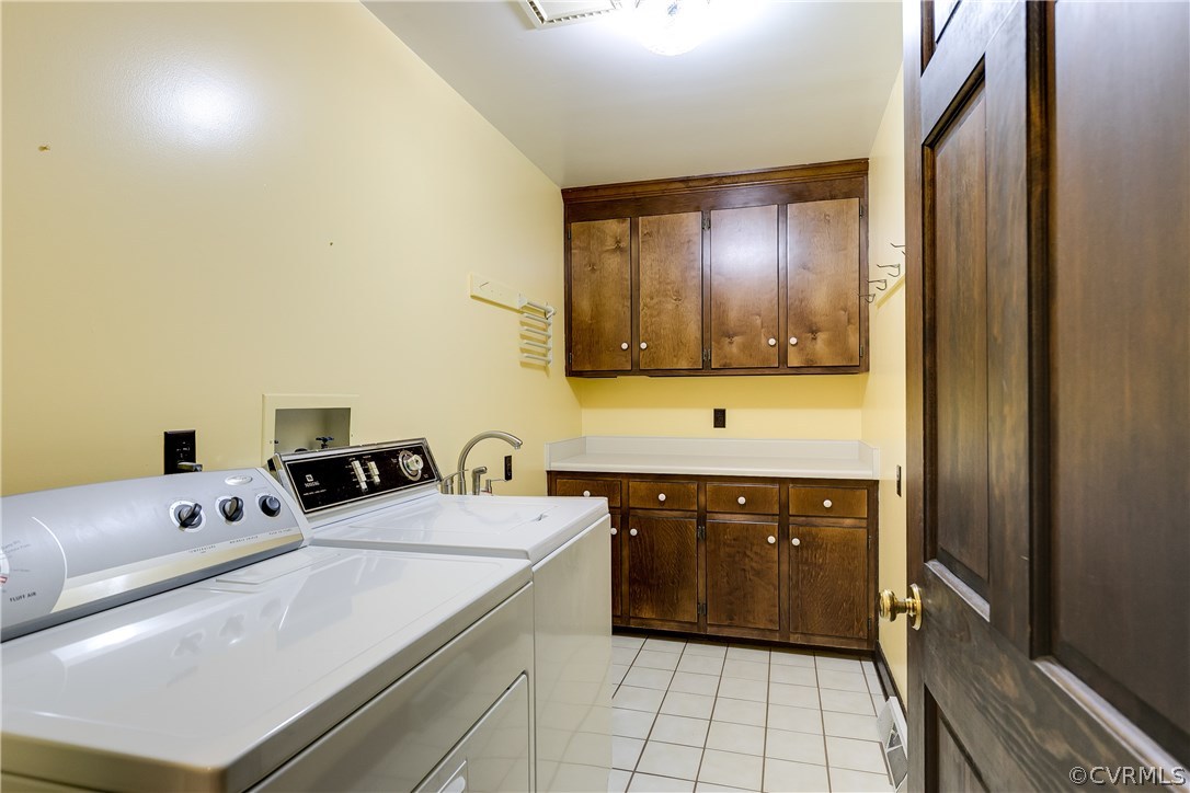 11292 Old Ridge Road Doswell, VA 23047 - Photo 28 of 45 Laundry Room offers tile floor, upper and lower ca