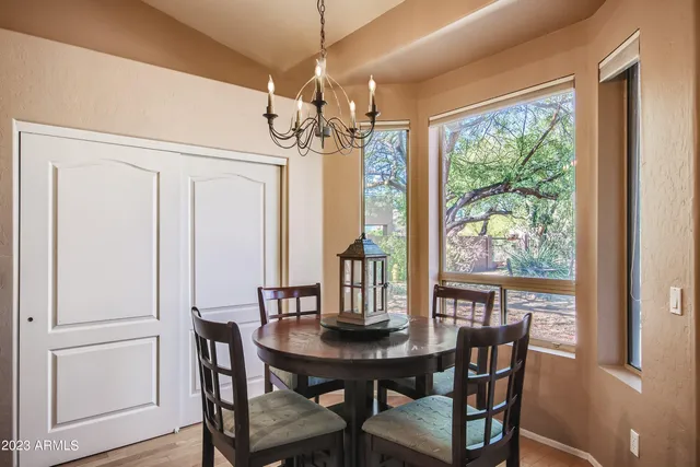 a view of a dining room with furniture window and outside view