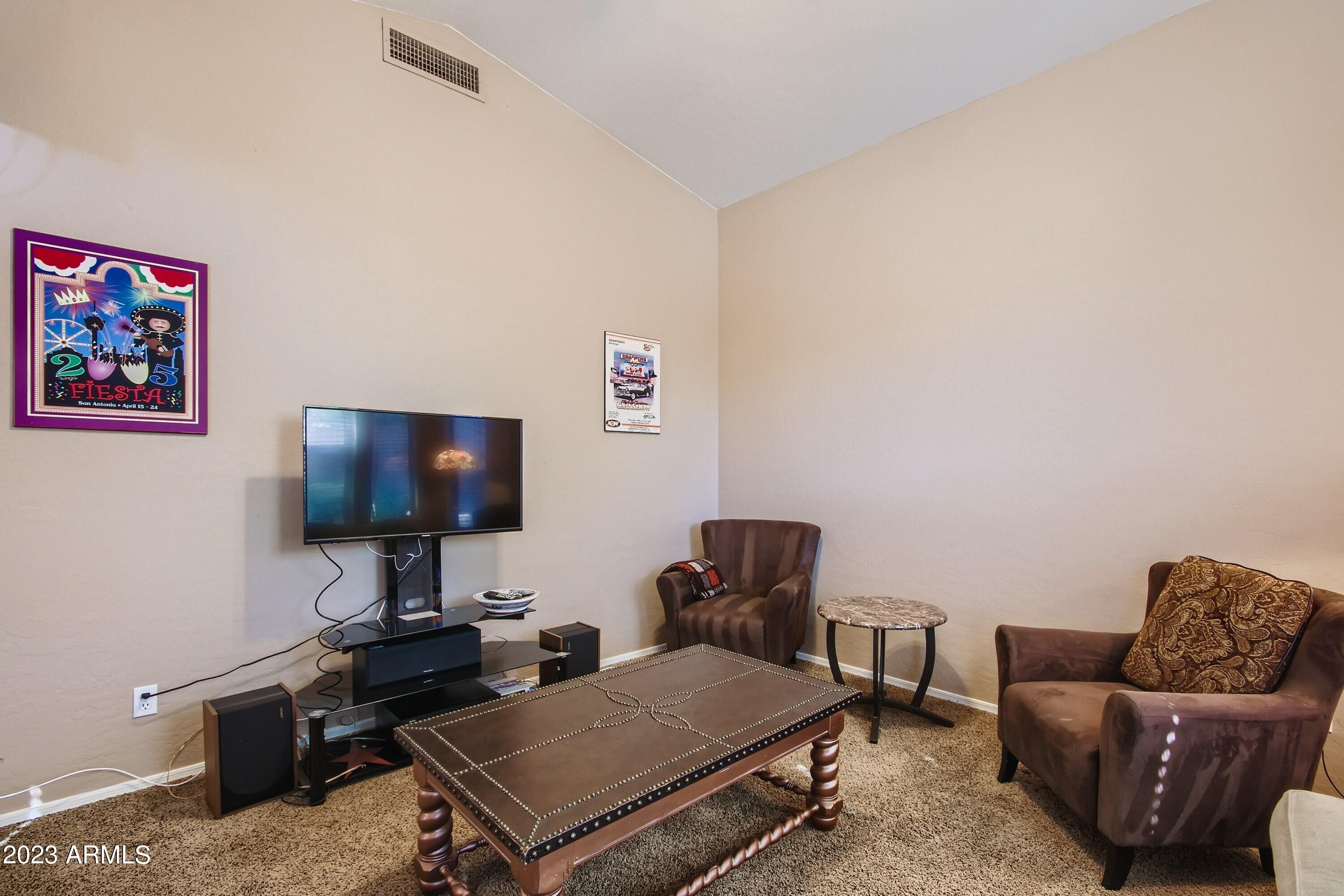 3060 North Ridgecrest, Unit 175 Mesa, AZ 85207 - Photo 15 of 28 a living room with furniture and a flat screen tv