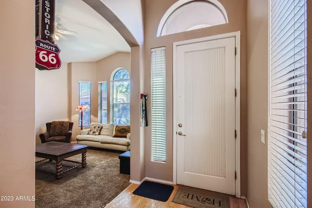 a living room with furniture and a gate