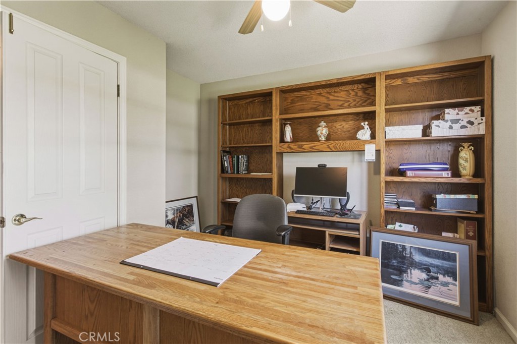 3856 North Gardner Avenue Merced, CA 95340 - Photo 40 of 59 a room with a table and a book shelf