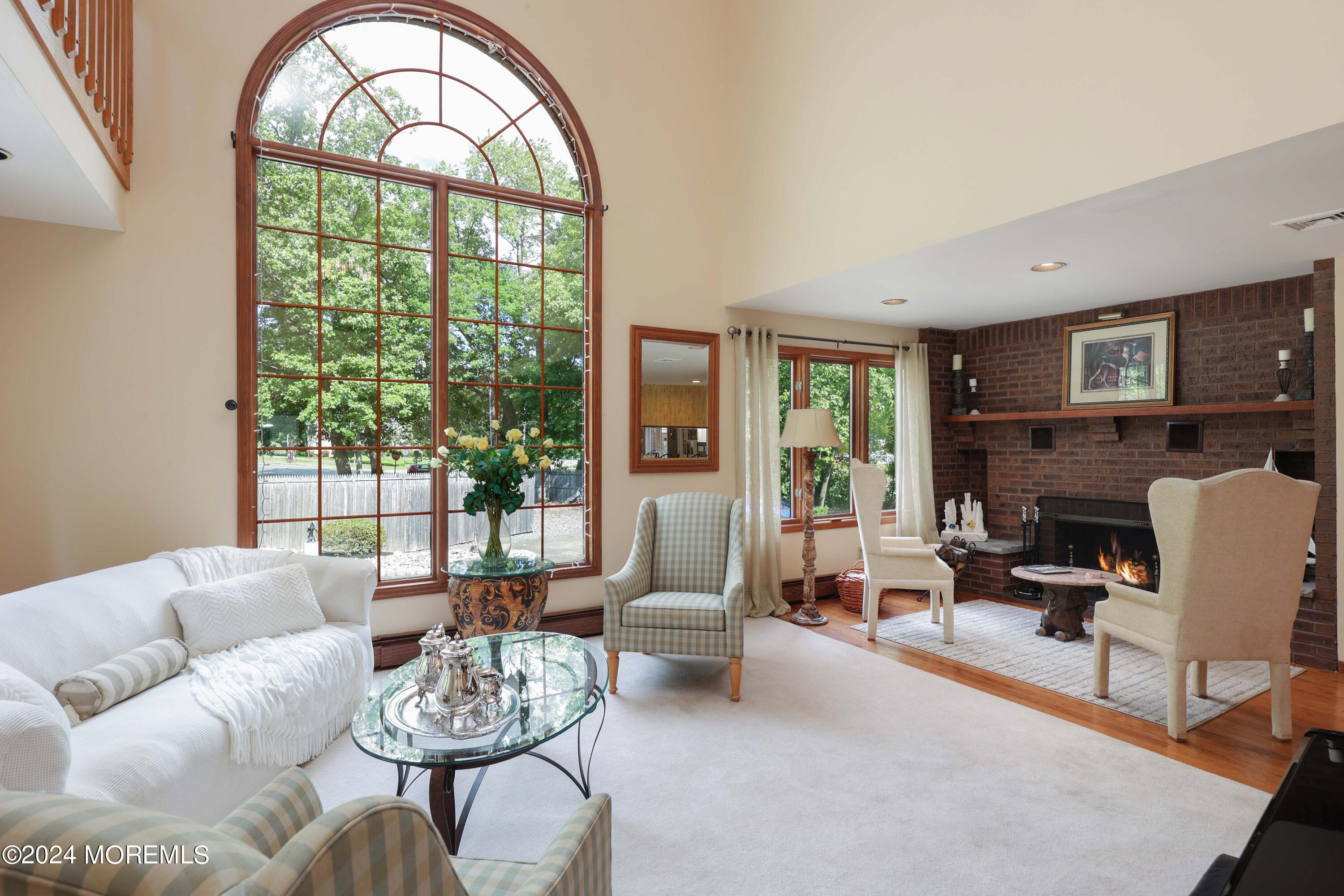 516 Matawan Avenue Keyport, NJ 07735 - Photo 11 of 59 a living room with furniture fireplace and a large window