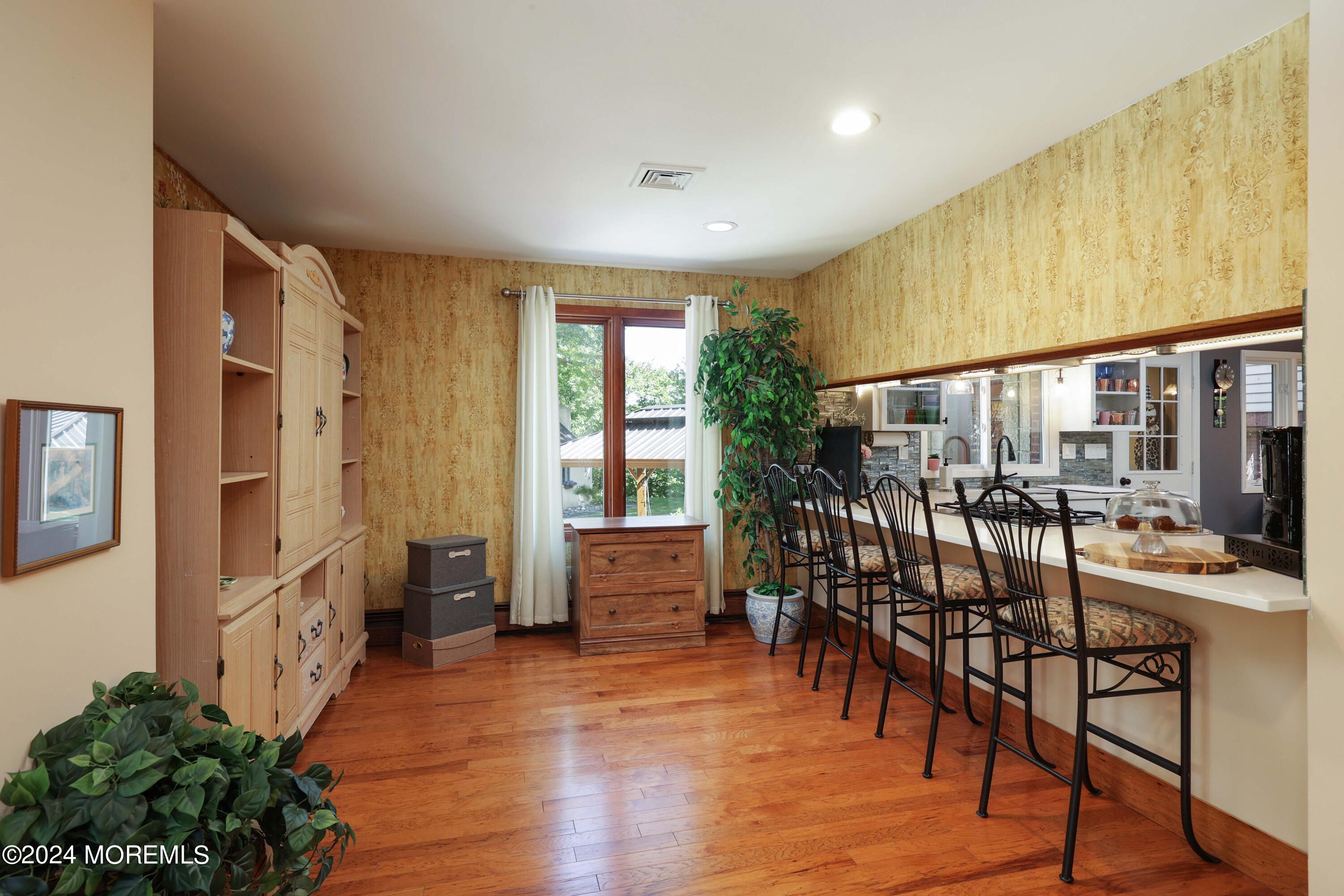 516 Matawan Avenue Keyport, NJ 07735 - Photo 16 of 59 a view of a a dining room with furniture window and wooden floor