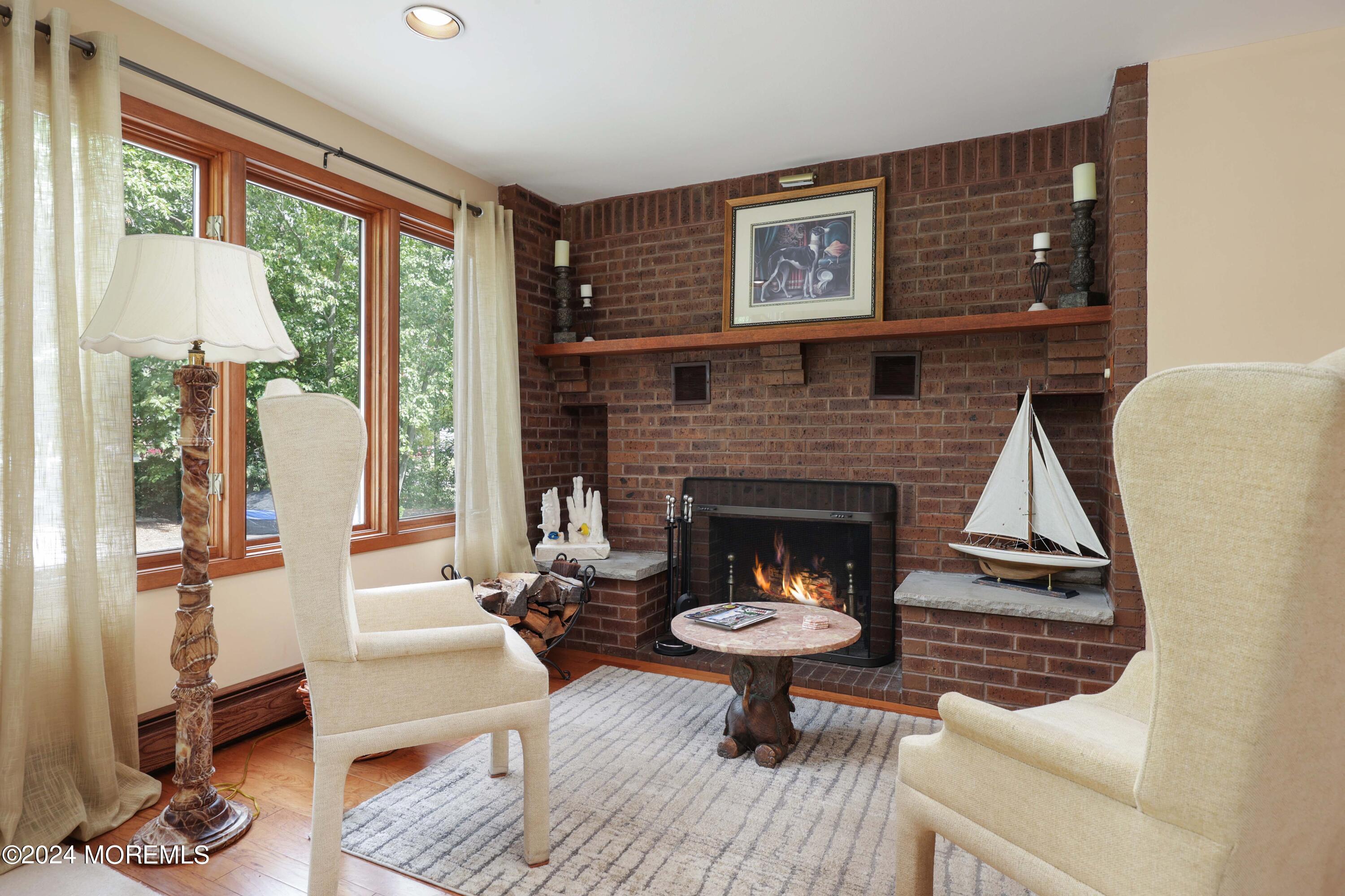 516 Matawan Avenue Keyport, NJ 07735 - Photo 19 of 59 a living room with furniture a table and a fireplace