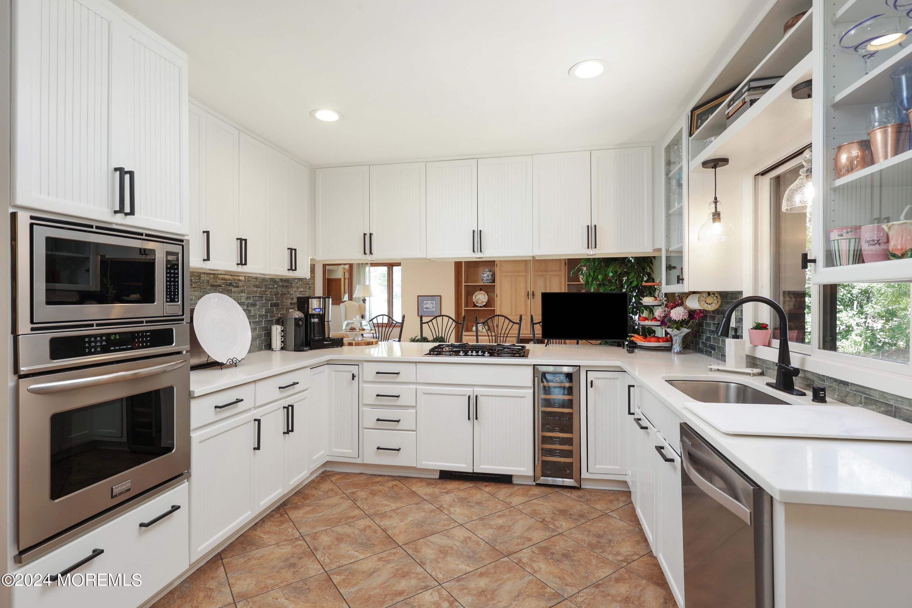 516 Matawan Avenue Keyport, NJ 07735 - Photo 25 of 59 a kitchen with granite countertop a sink stainless steel appliances and cabinets