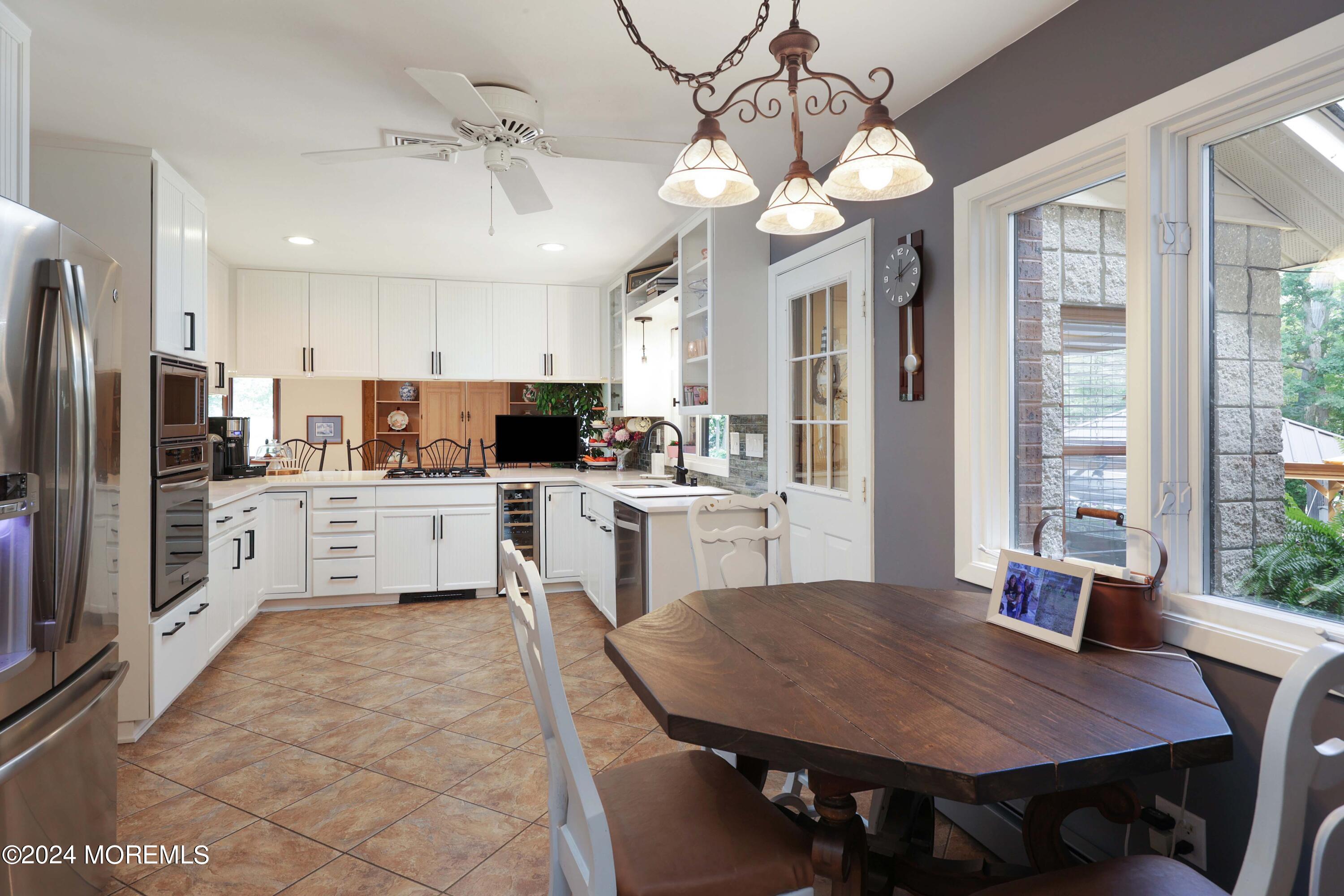 516 Matawan Avenue Keyport, NJ 07735 - Photo 27 of 59 a kitchen with cabinets stainless steel appliances and a dining table view