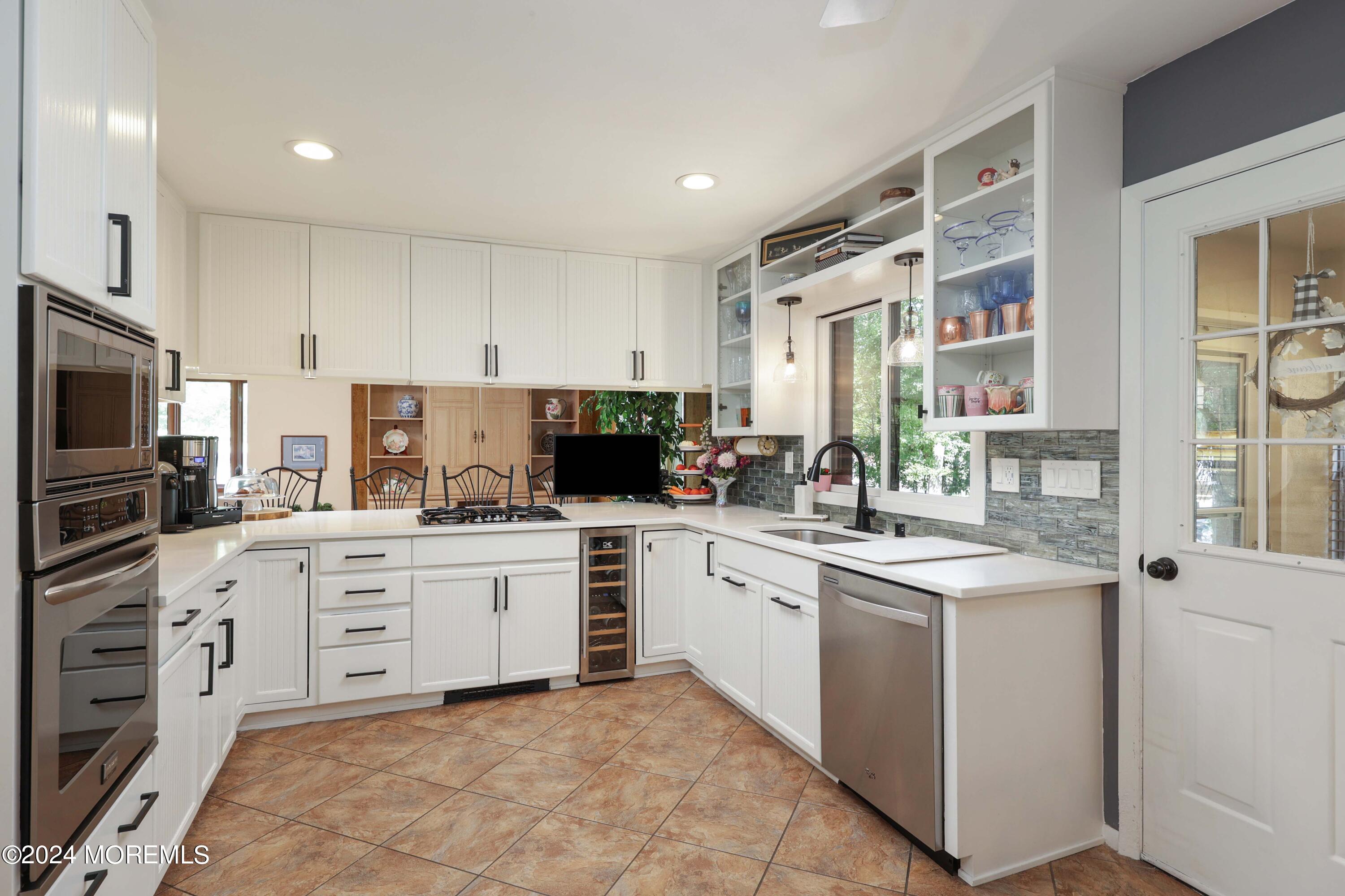 516 Matawan Avenue Keyport, NJ 07735 - Photo 28 of 59 a kitchen with white cabinets and white appliances