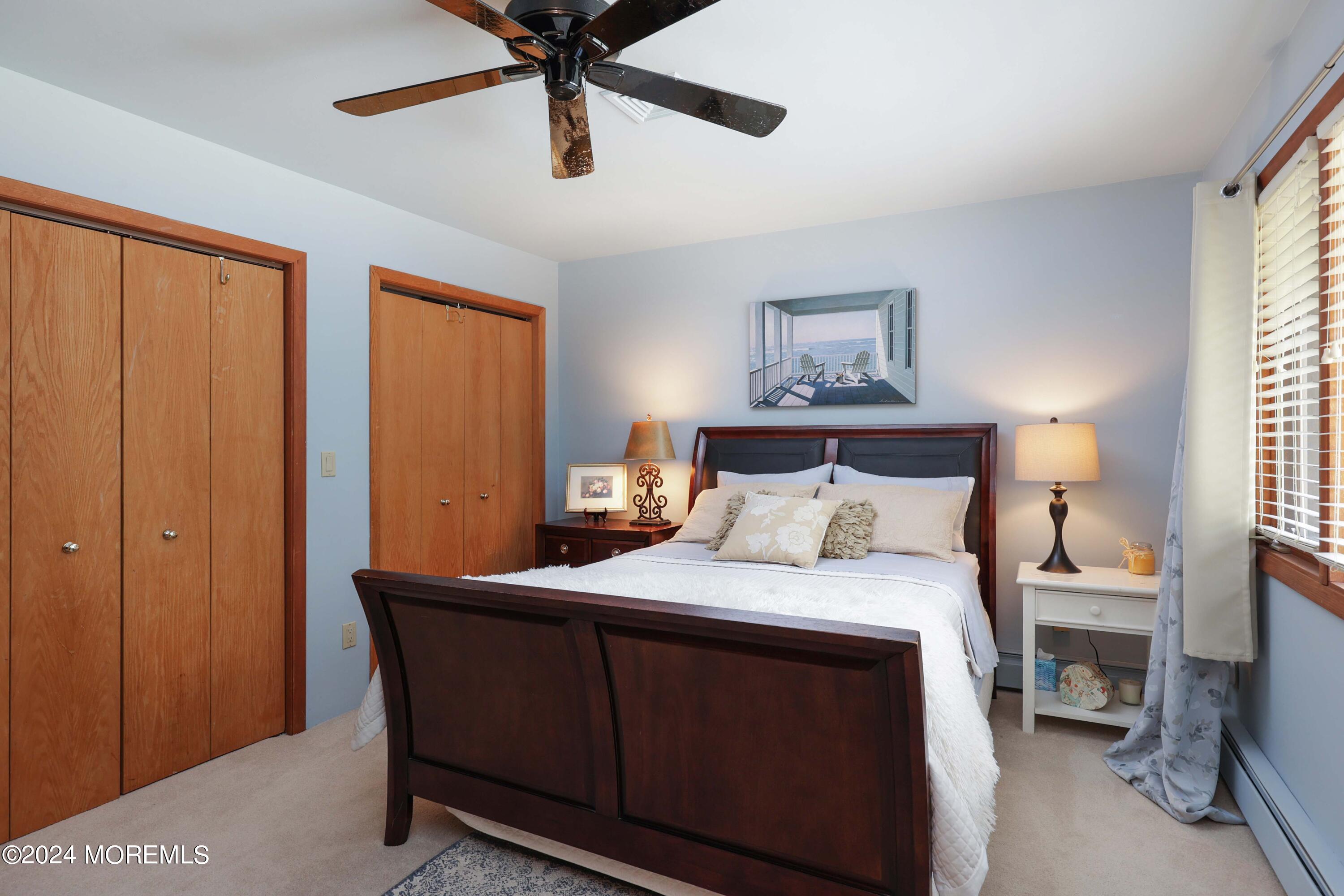 516 Matawan Avenue Keyport, NJ 07735 - Photo 32 of 59 a bedroom with a bed and a chandelier