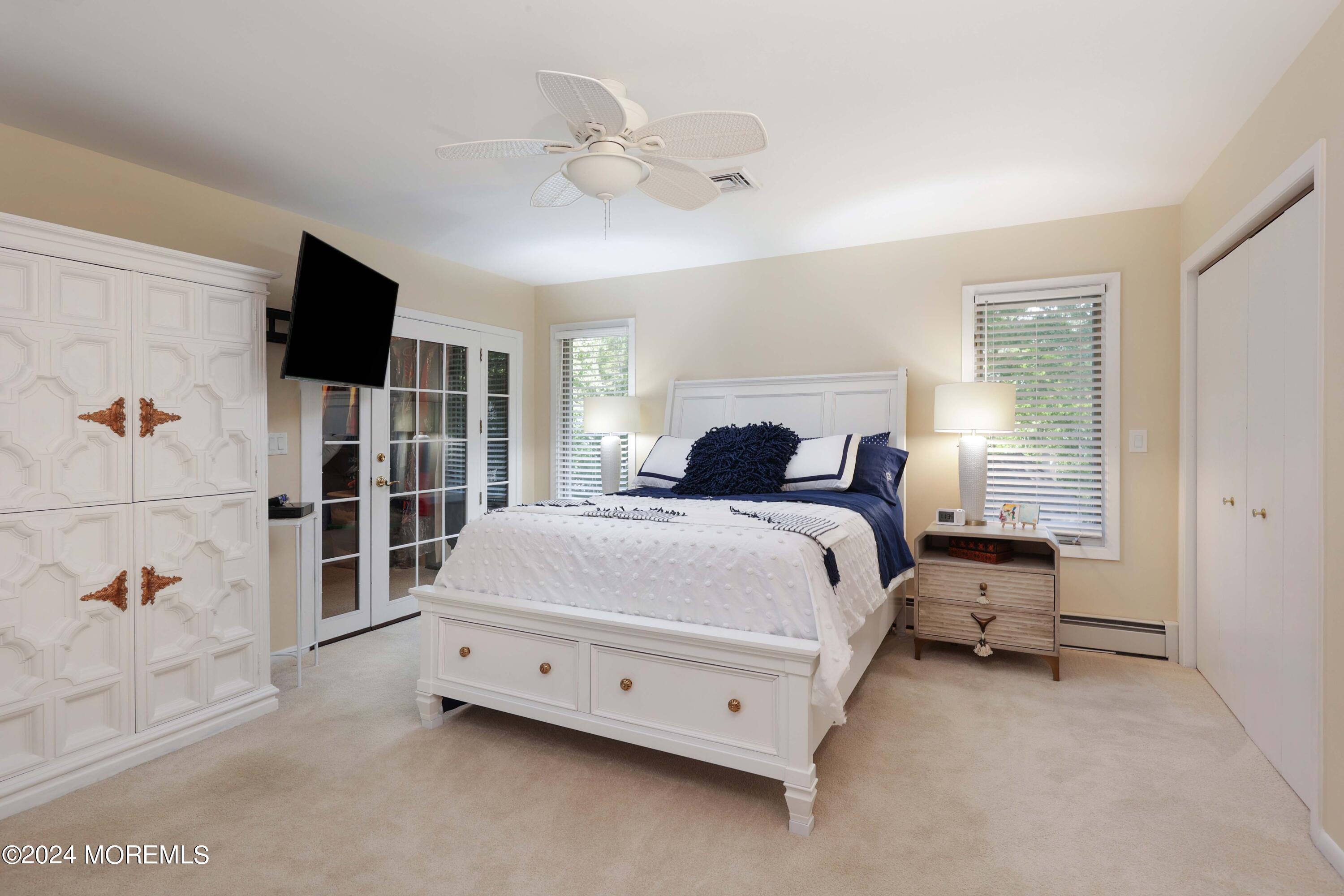 516 Matawan Avenue Keyport, NJ 07735 - Photo 35 of 59 a bedroom with a bed and flat screen tv