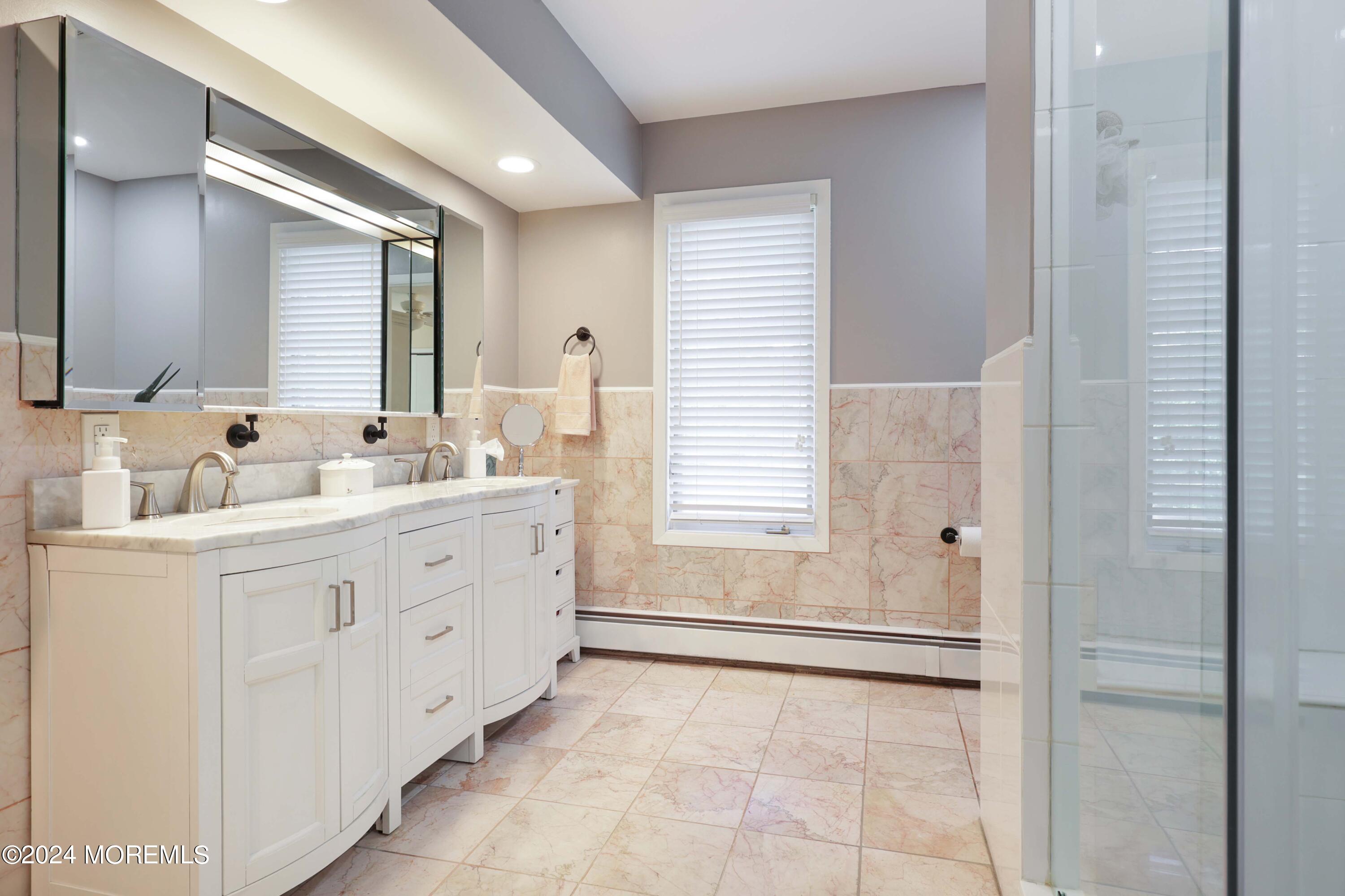 516 Matawan Avenue Keyport, NJ 07735 - Photo 39 of 59 a bathroom with a sink mirror and a bathtub