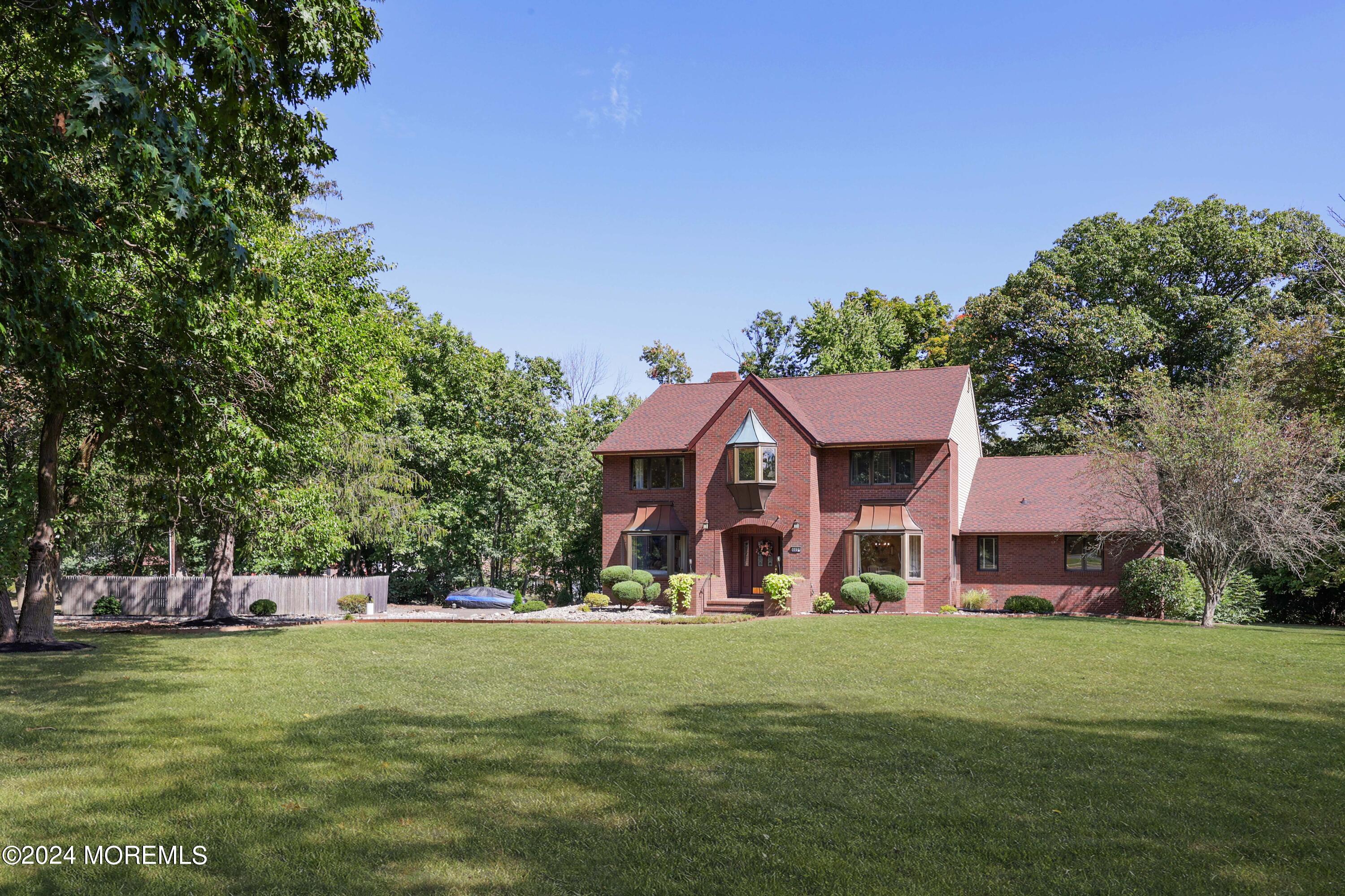 516 Matawan Avenue Keyport, NJ 07735 - Photo 42 of 59 a view of a big house with a big yard and large trees