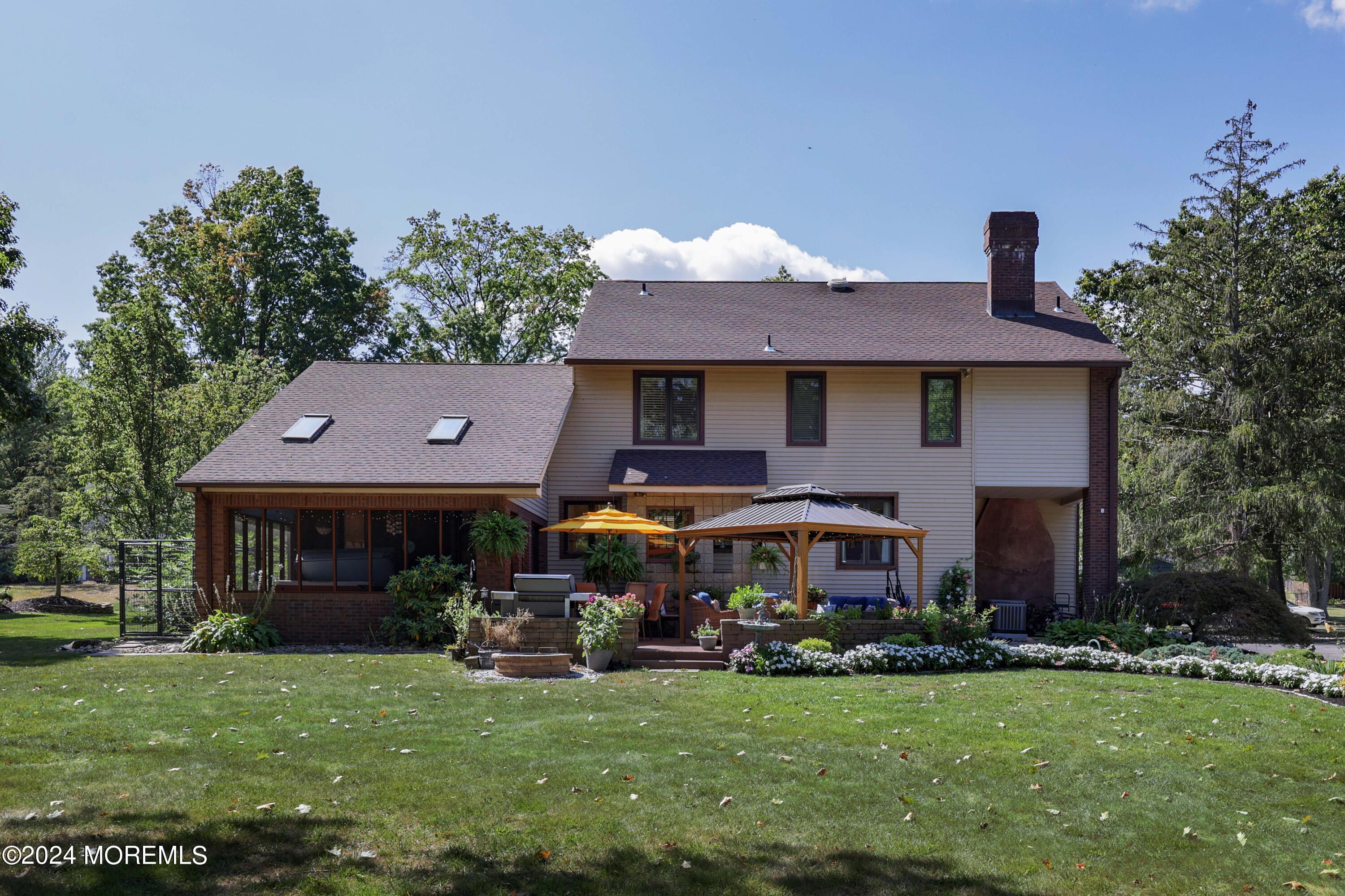 516 Matawan Avenue Keyport, NJ 07735 - Photo 43 of 59 a front view of a house with garden