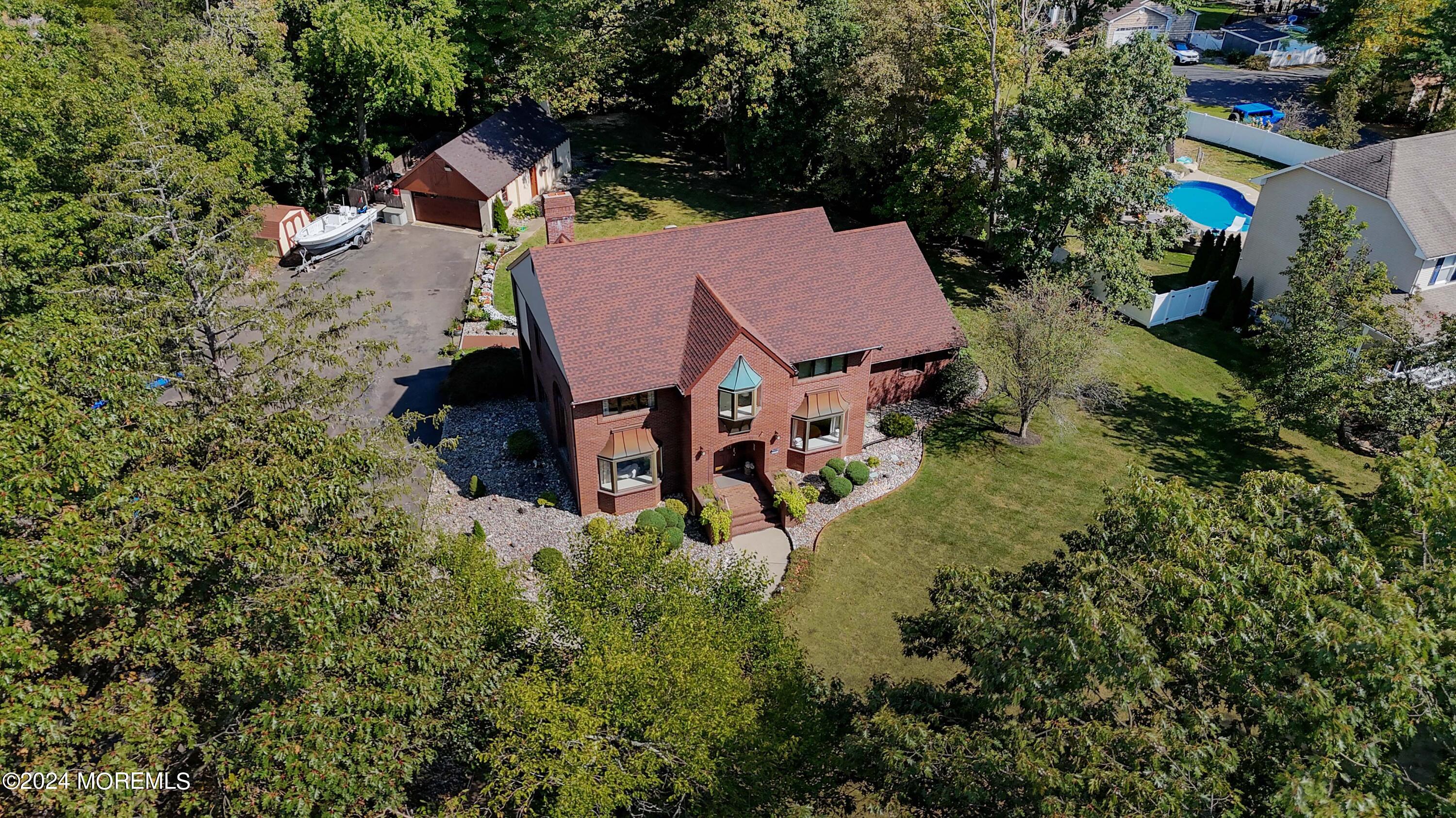 516 Matawan Avenue Keyport, NJ 07735 - Photo 49 of 59 an aerial view of a house with swimming pool and garden