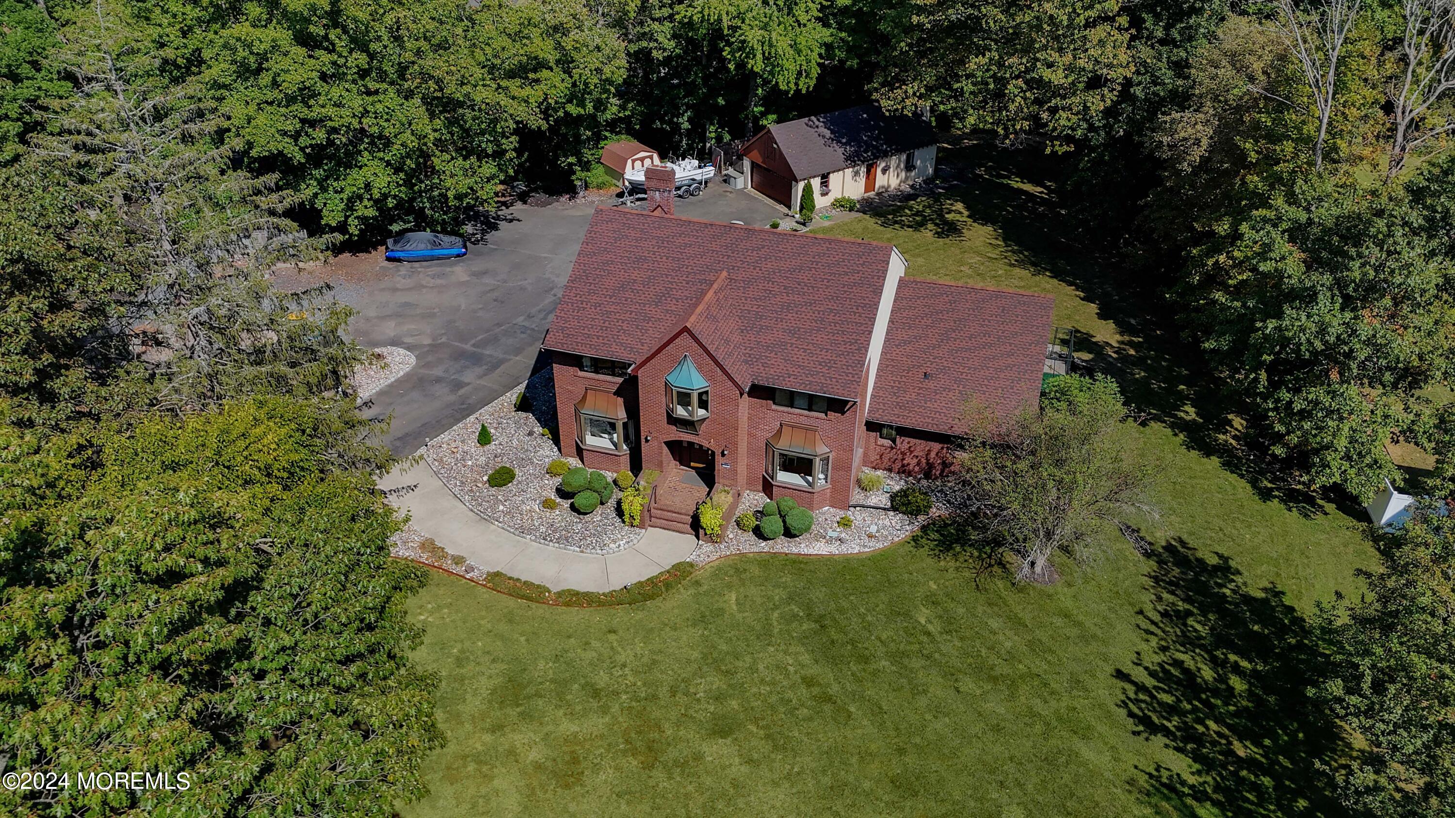 516 Matawan Avenue Keyport, NJ 07735 - Photo 51 of 59 an aerial view of a house with garden space and trees