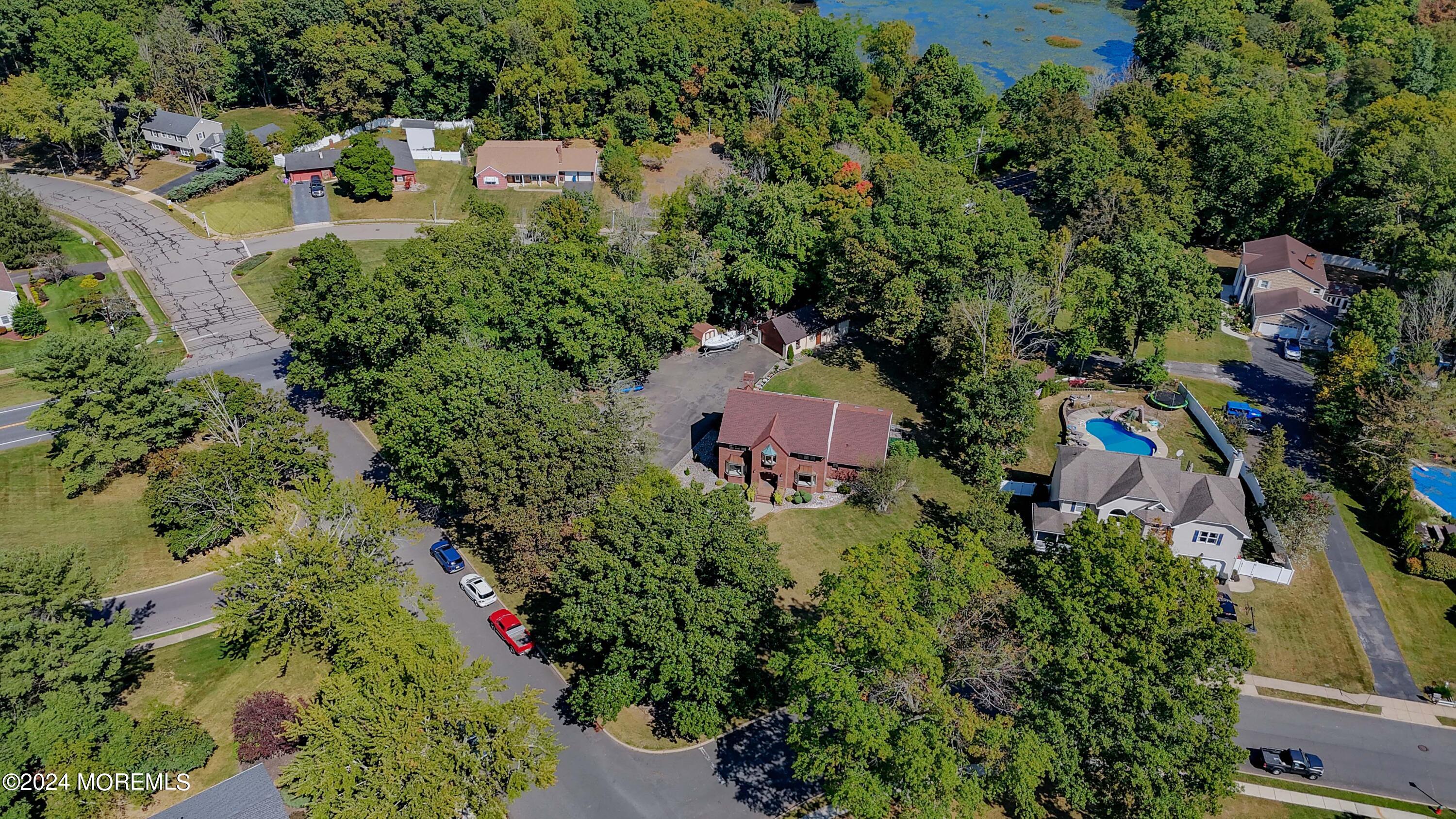 516 Matawan Avenue Keyport, NJ 07735 - Photo 53 of 59 an aerial view of residential house with outdoor space and trees all around