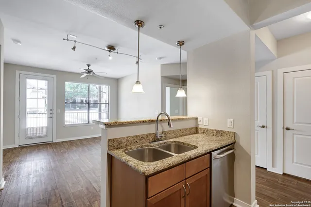 a kitchen with sink and window