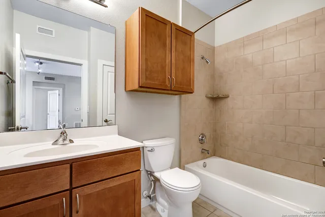 a bathroom with a sink a toilet and bathtub
