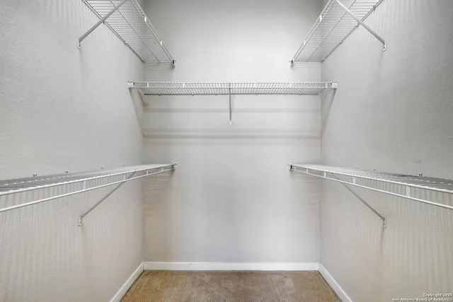 a view of a room with racks on the wall