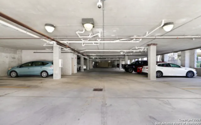 a view of parking with cars parked