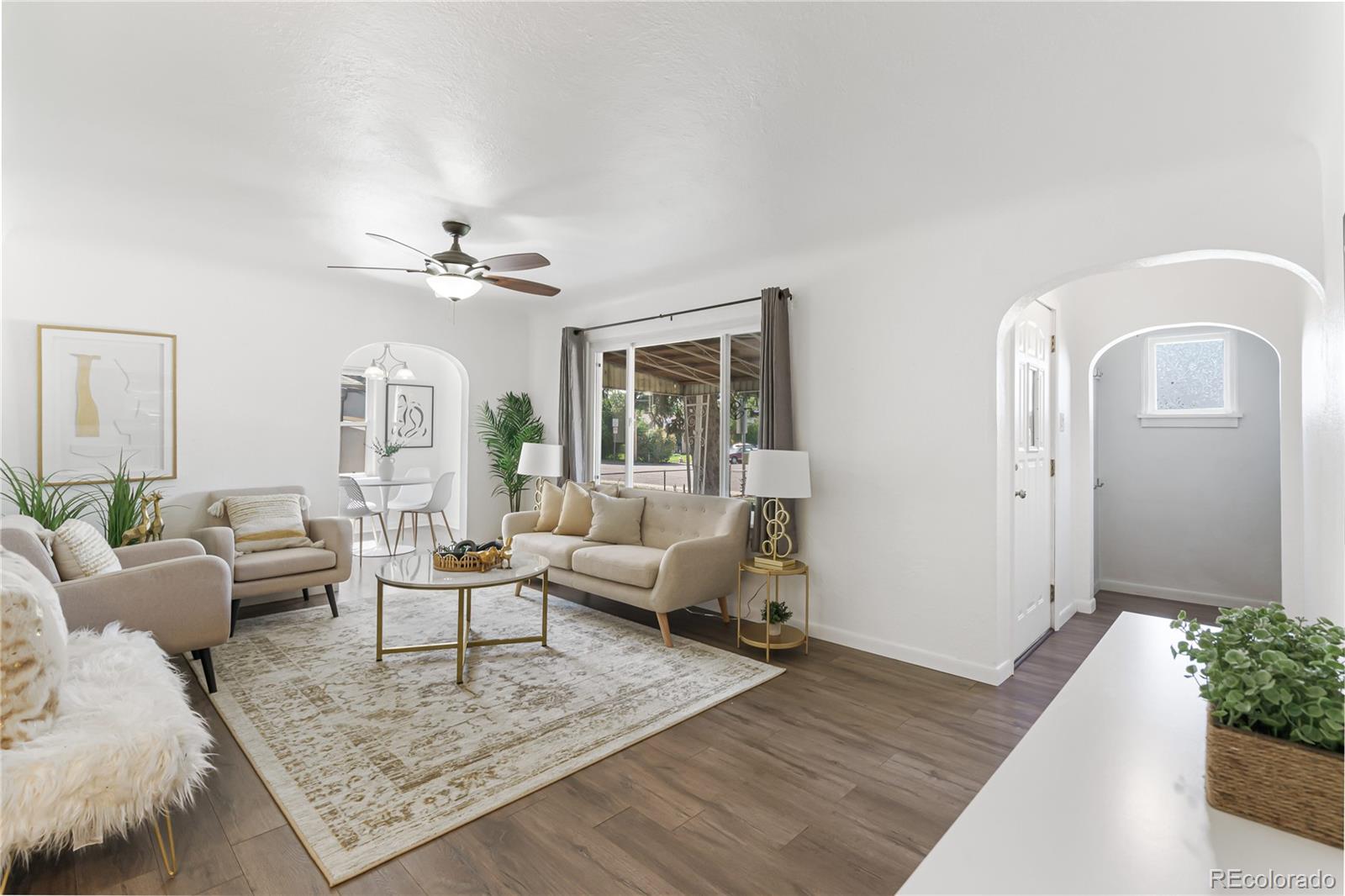 a living room with furniture rug and window