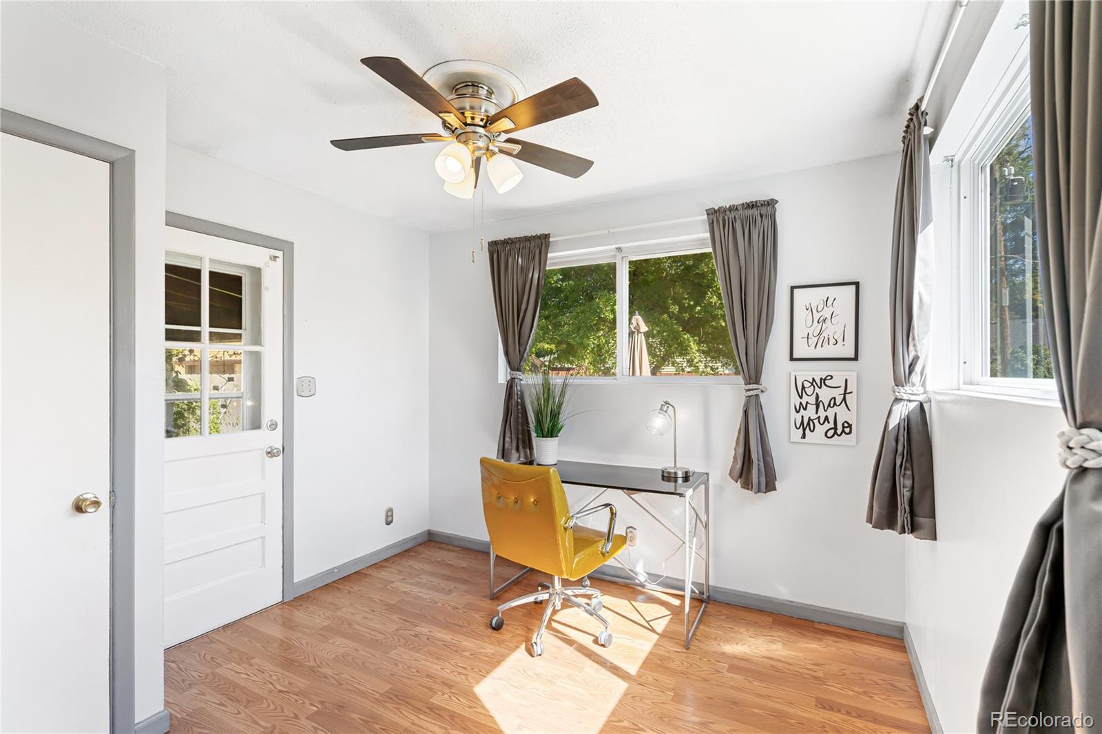 3880 Reed Street Wheat Ridge, CO 80033 - Photo 24 of 40 a view of a workspace with furniture and a window