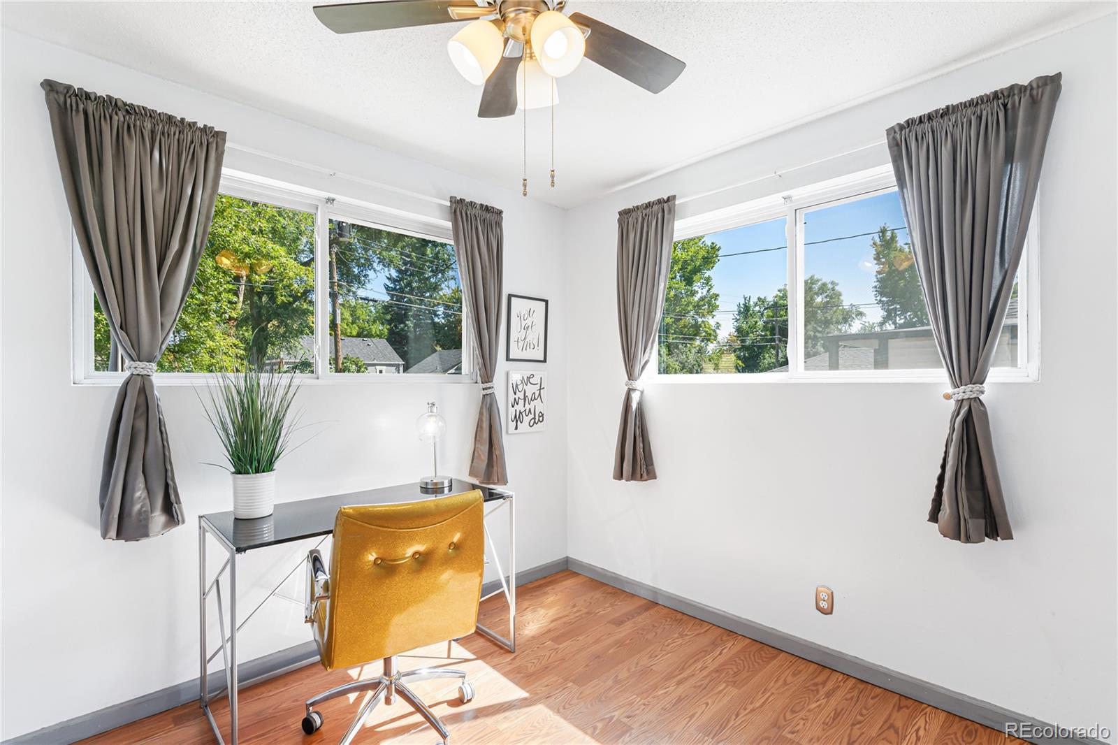 3880 Reed Street Wheat Ridge, CO 80033 - Photo 25 of 40 a view of living room with furniture and a large window