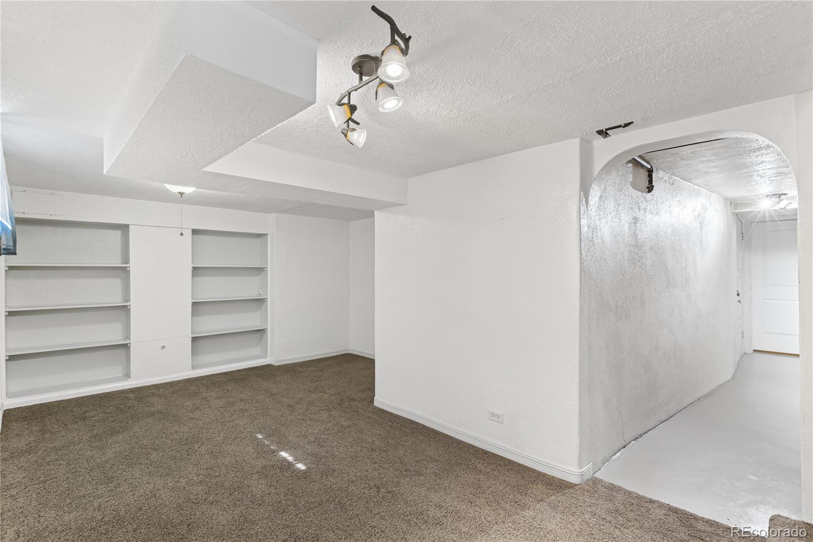3880 Reed Street Wheat Ridge, CO 80033 - Photo 26 of 40 a view of an empty room with a closet