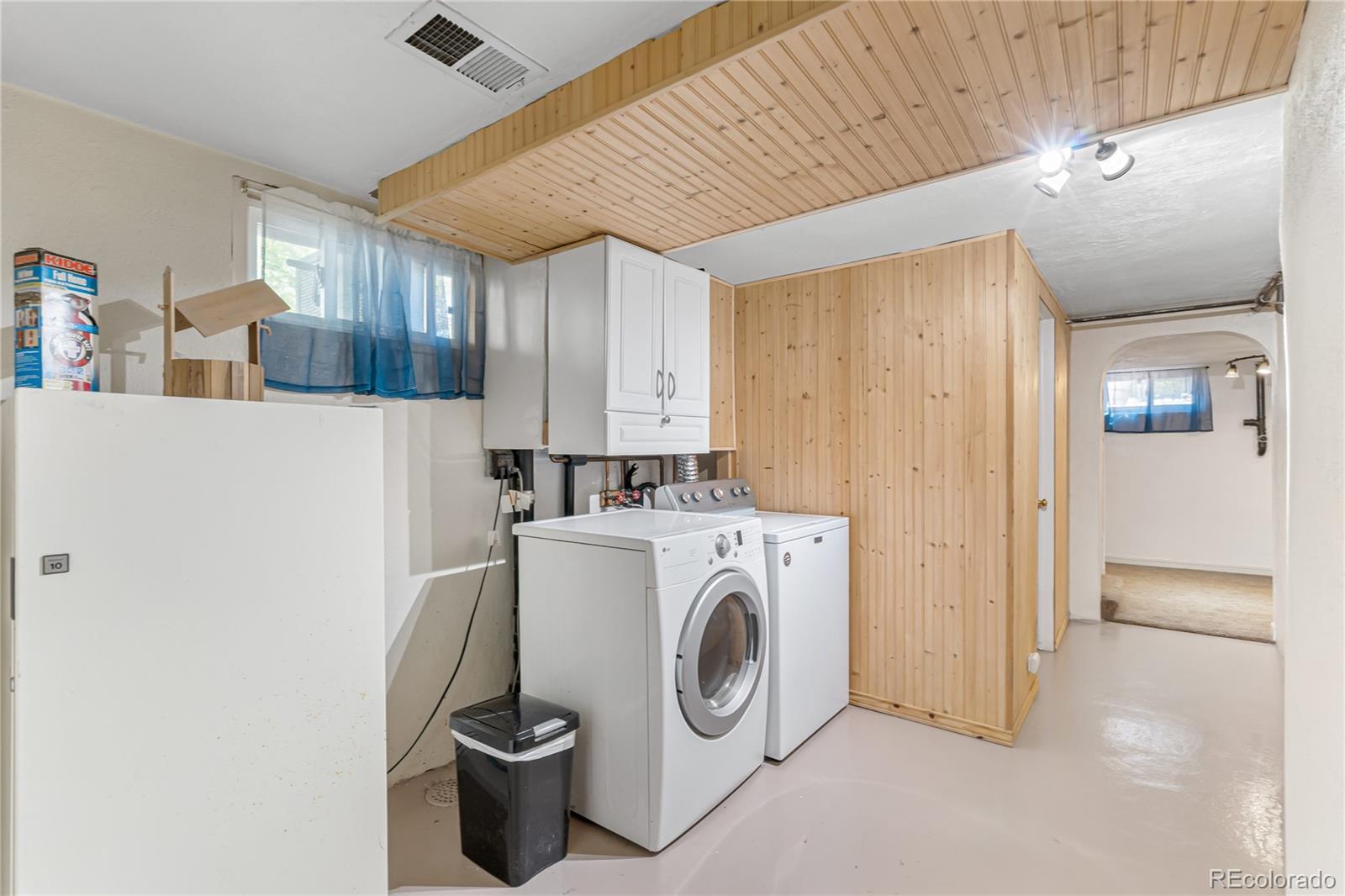 3880 Reed Street Wheat Ridge, CO 80033 - Photo 30 of 40 a utility room with dryer and washer