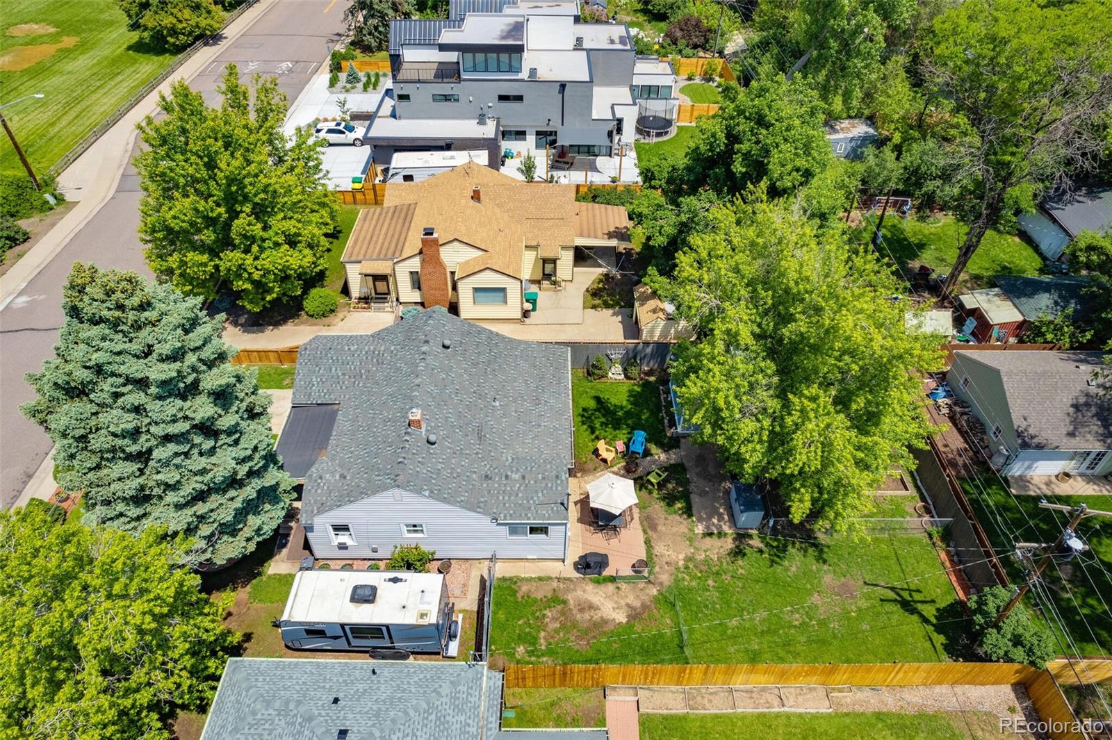 3880 Reed Street Wheat Ridge, CO 80033 - Photo 34 of 40 an aerial view of residential houses with outdoor space and trees all around