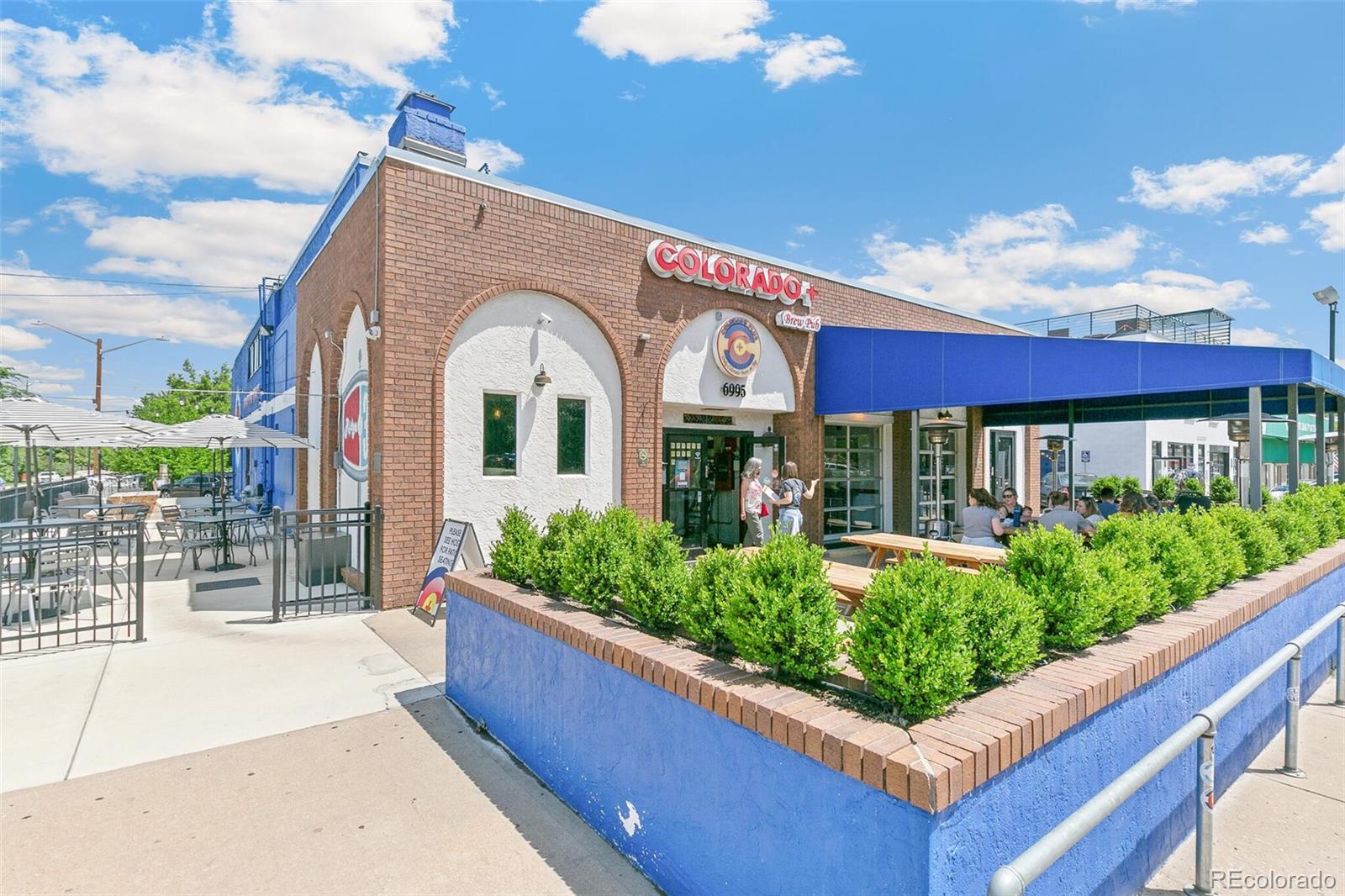 3880 Reed Street Wheat Ridge, CO 80033 - Photo 36 of 40 a front view of a house with a yard