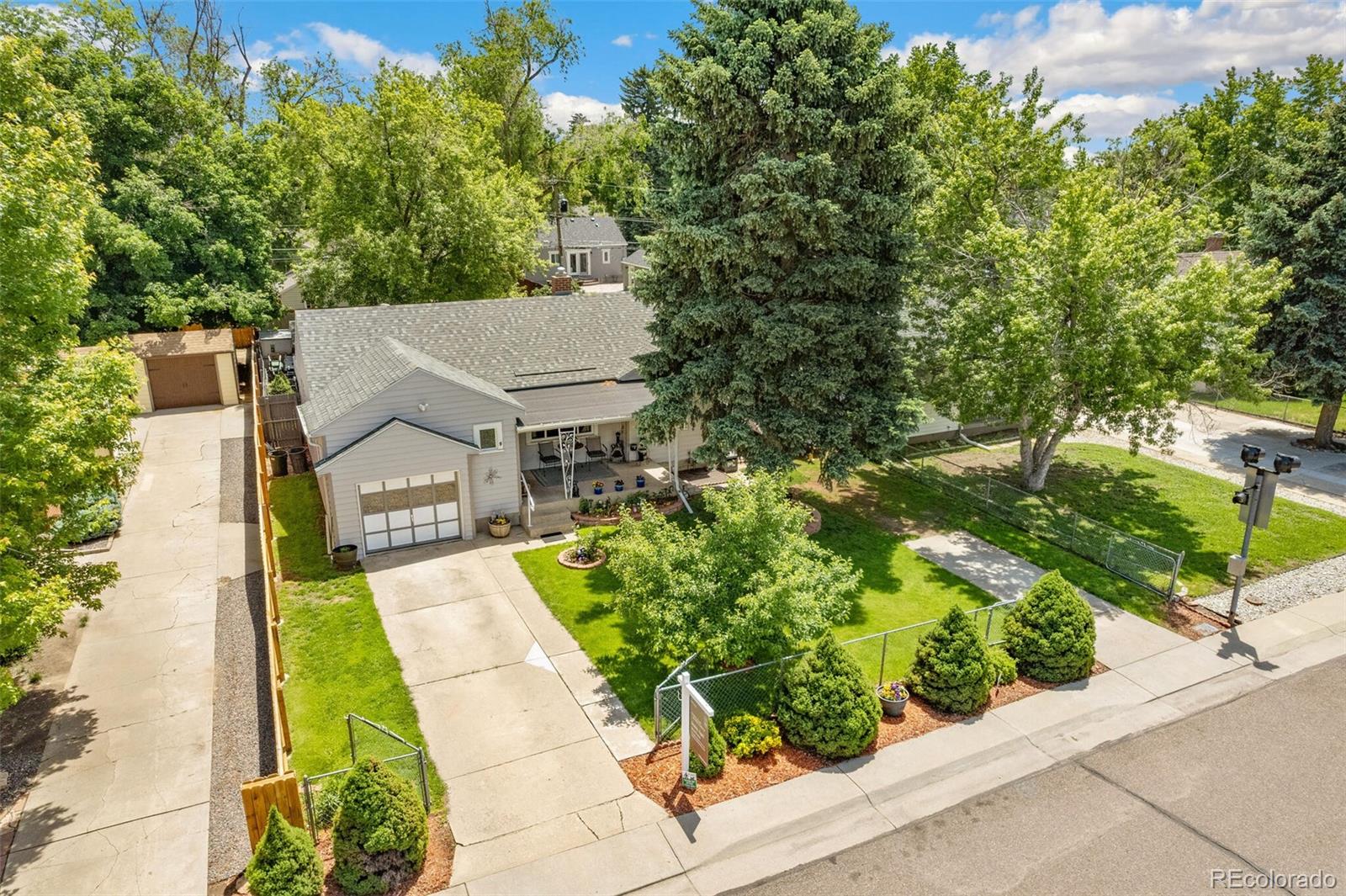 3880 Reed Street Wheat Ridge, CO 80033 - Photo 5 of 40 a view of a house with a yard