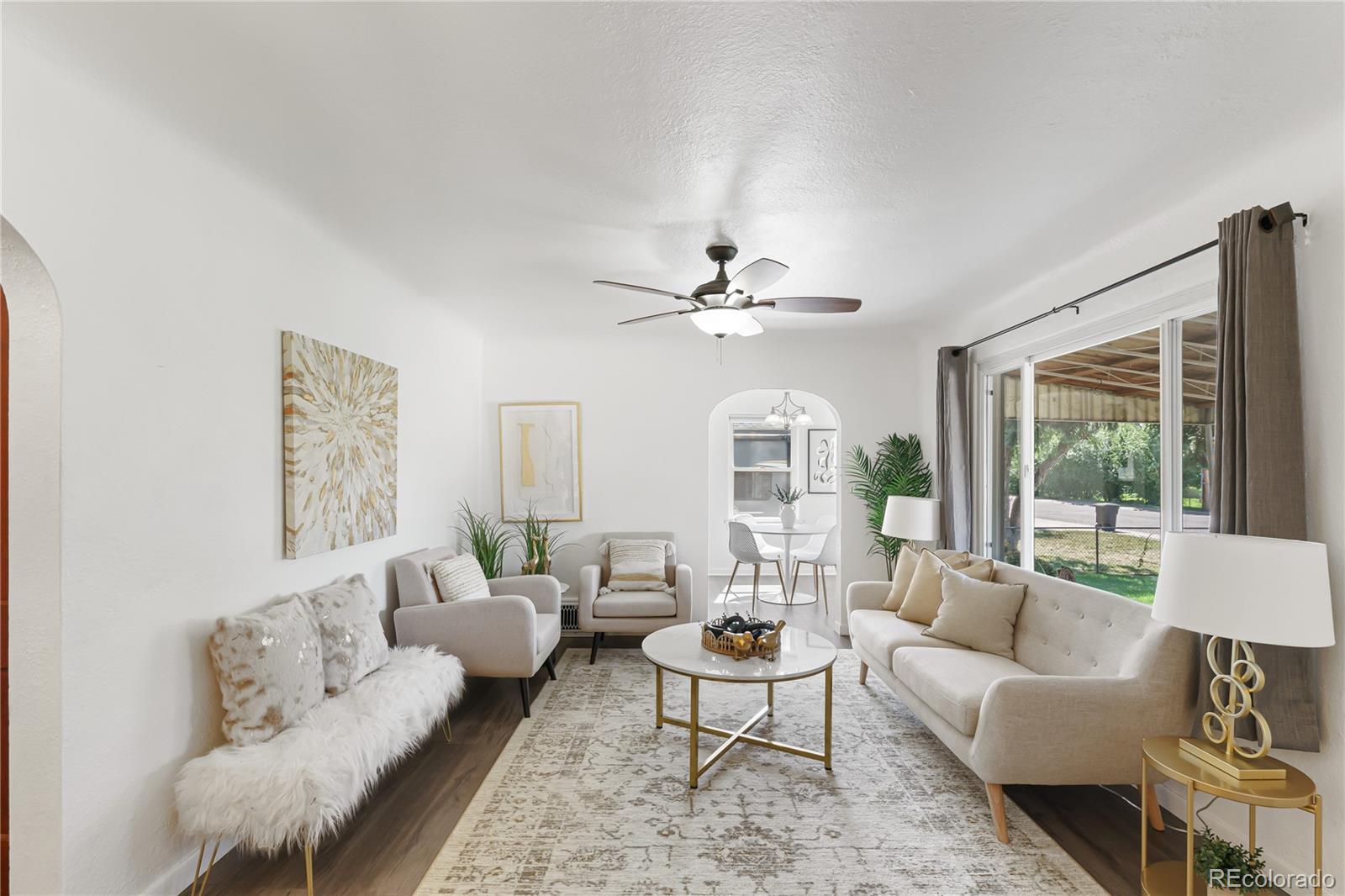 3880 Reed Street Wheat Ridge, CO 80033 - Photo 6 of 40 a living room with furniture and a large window