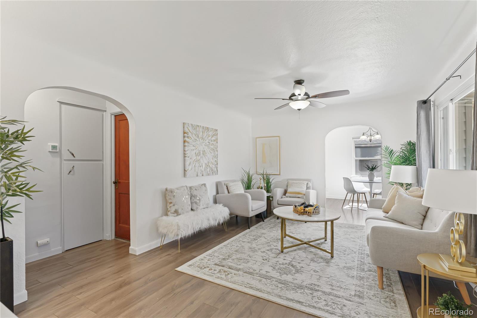 3880 Reed Street Wheat Ridge, CO 80033 - Photo 7 of 40 a living room with furniture and a large window