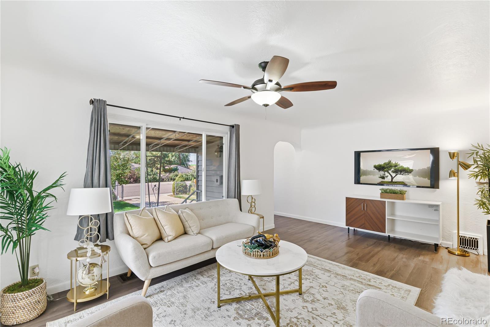 3880 Reed Street Wheat Ridge, CO 80033 - Photo 8 of 40 a living room with furniture and a large window